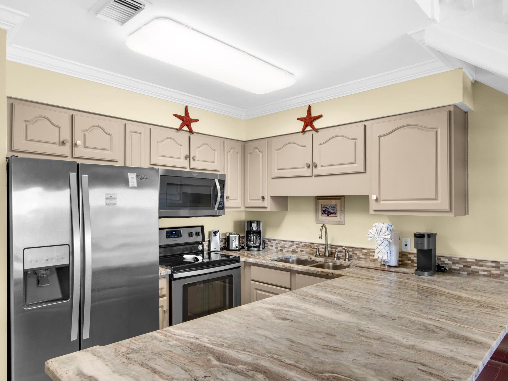 Your fully equipped kitchen features modern appliances and granite counters, perfect for preparing meals during your stay.