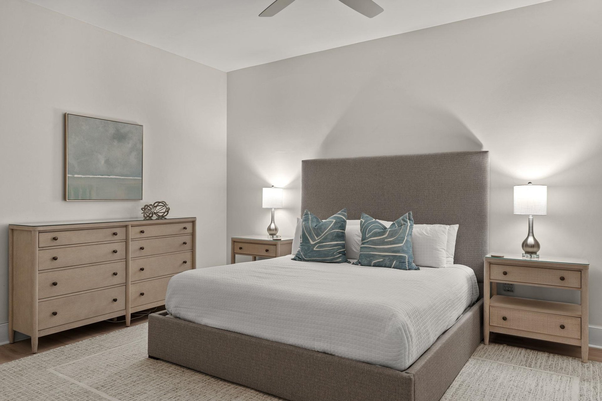 Unwind in your serene bedroom sanctuary with soft linens, elegant furnishings, and gentle lighting creating the perfect retreat for restful nights.