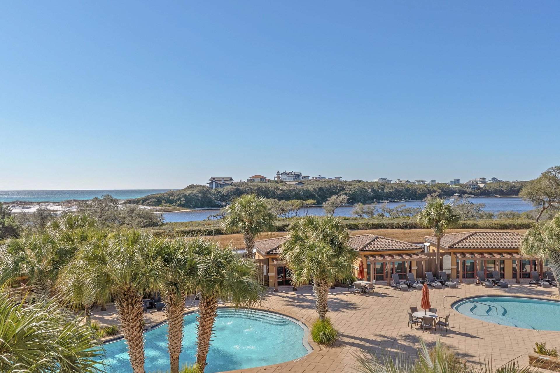 Sweeping coastal views stretch across pristine beaches and azure waters from this elevated gulf front location.