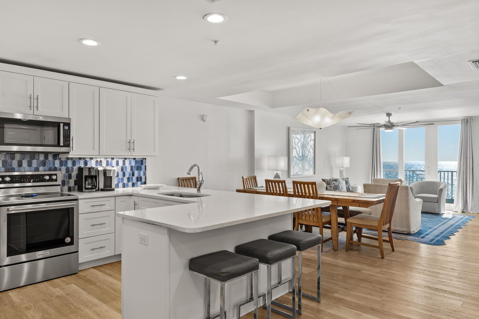 The openconcept kitchen flows into the dining and living areas.