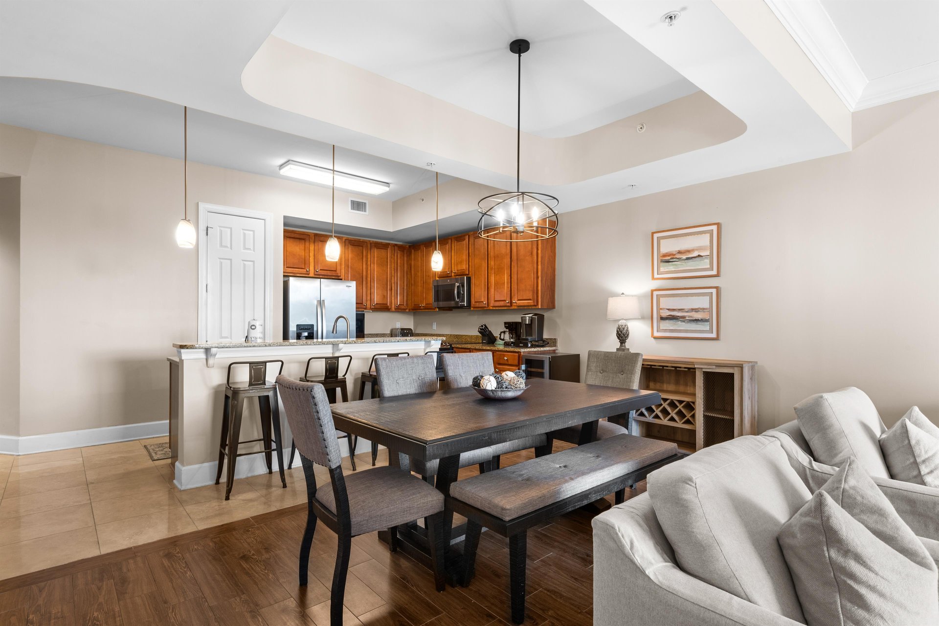 This spacious openconcept haven features a fullyequipped kitchen, elegant dining table, and plush seating for memorable meals together.