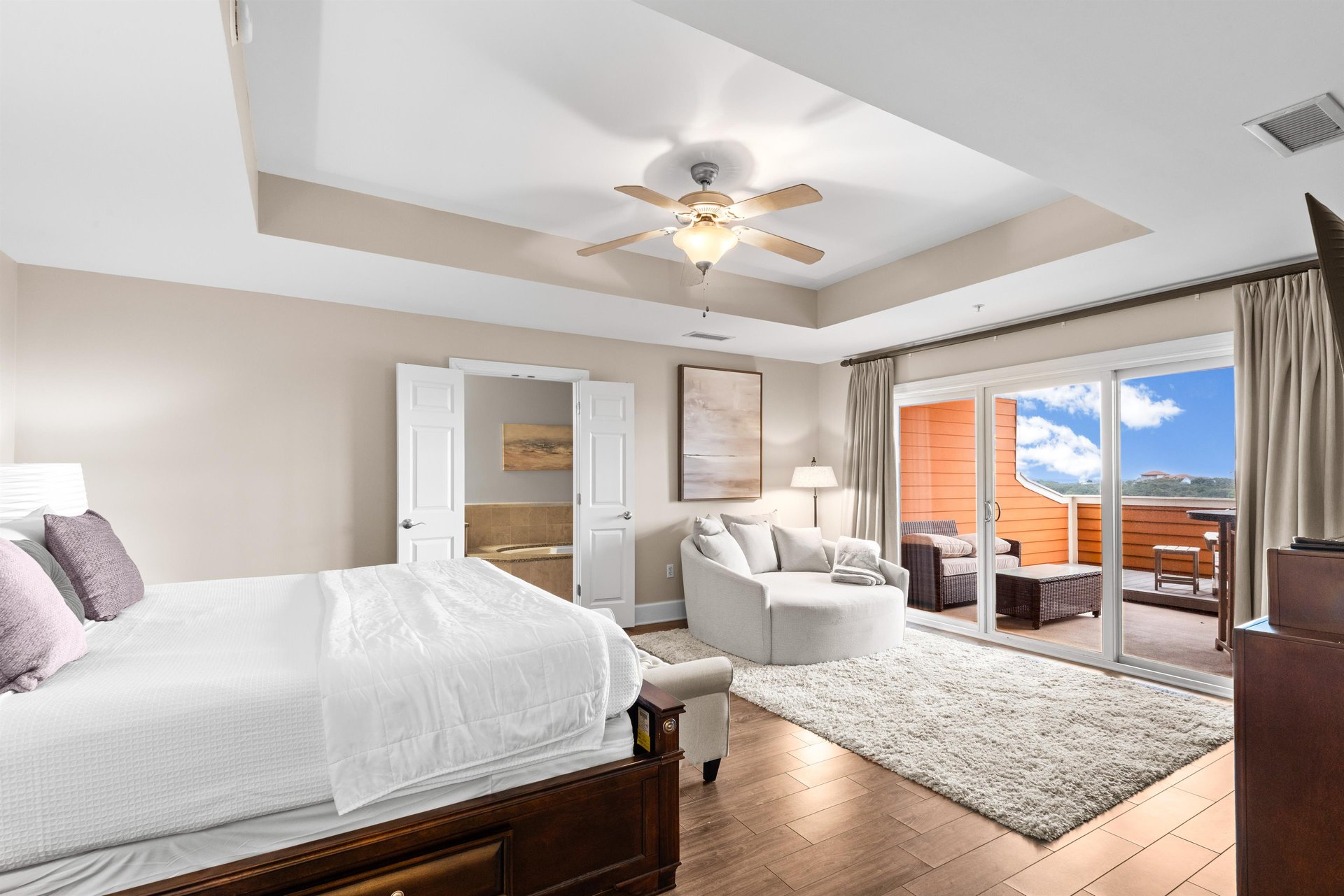 Unwind in this spacious suite where plush seating and private balcony create the perfect retreat for relaxation.