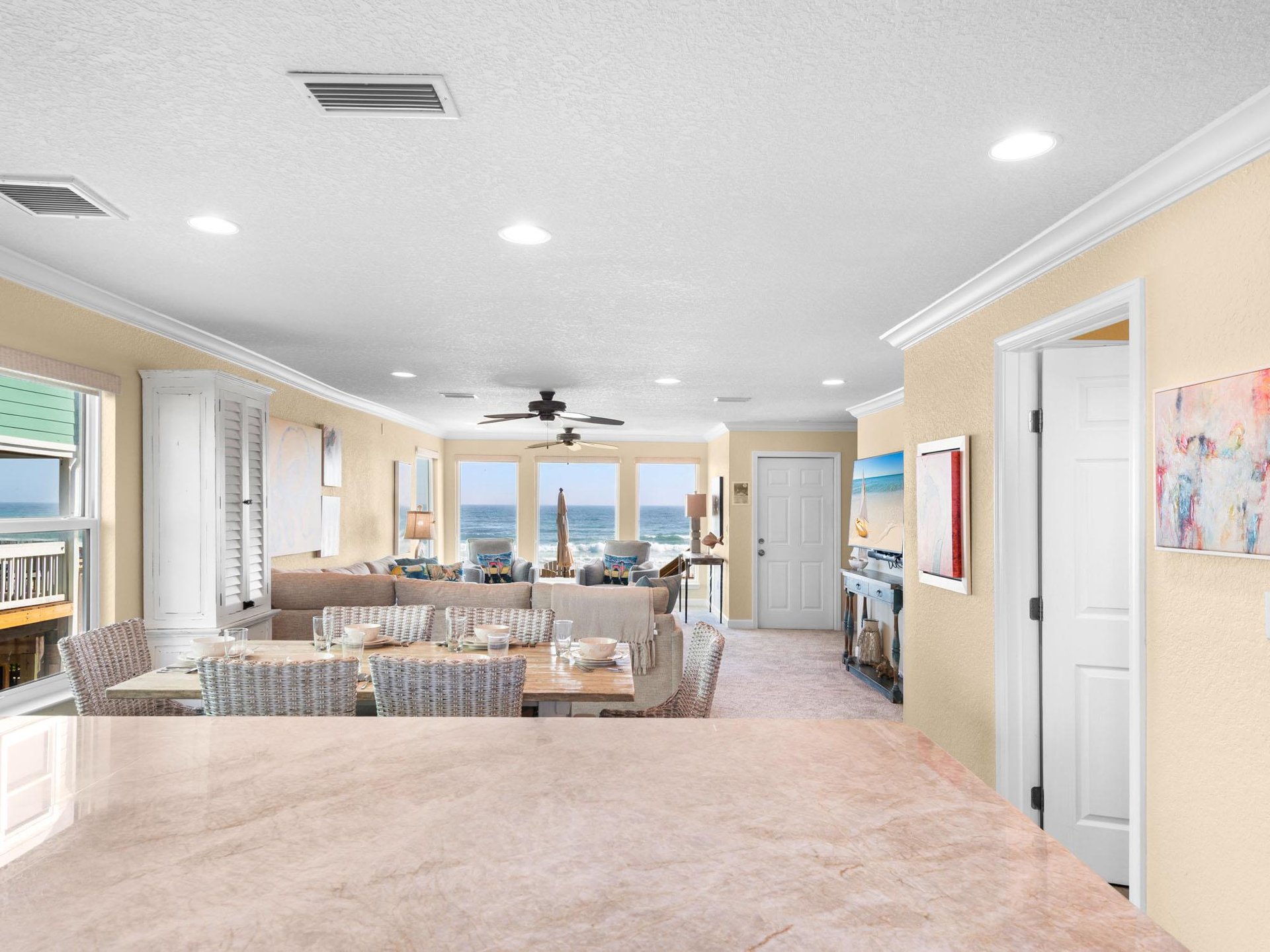 Your elegant living space opens to breathtaking Gulf views through floortoceiling windows, perfect for morning coffee or evening relaxation.