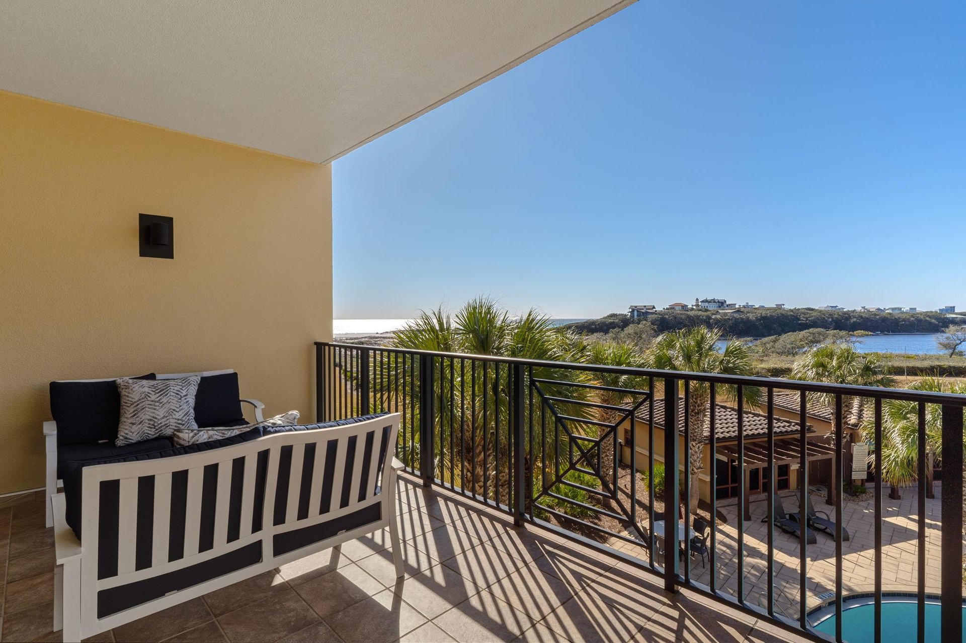 Relax on the private balcony with plush seating while enjoying stunning gulf and lake views stretching to the horizon.
