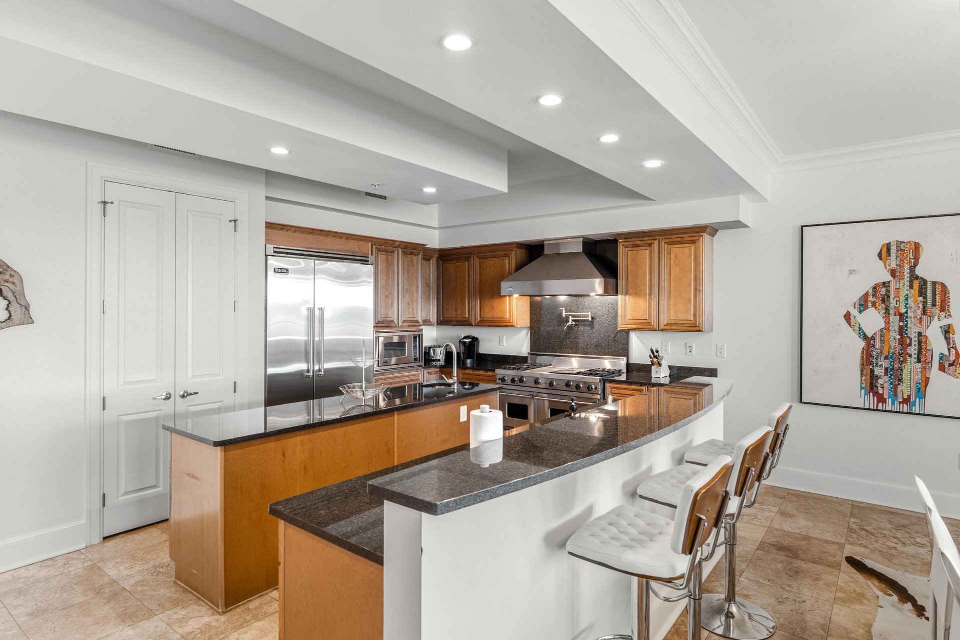 This gourmet kitchen features granite countertops, professionalgrade appliances, and a breakfast bar where youll love gathering for morning coffee.