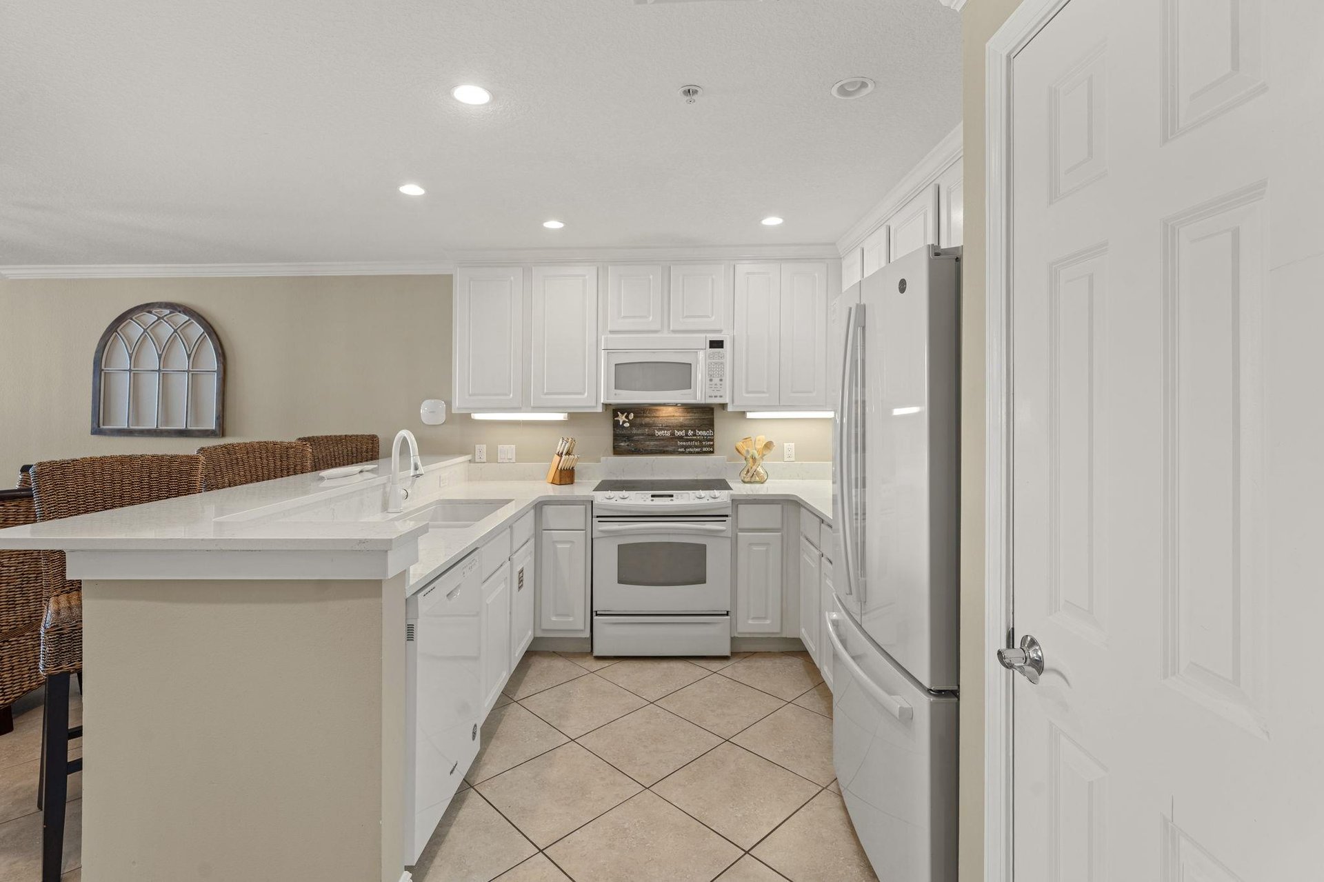 Cook your favorite meals in this bright, fullyequipped kitchen with modern appliances and plenty of counter space for prep work.