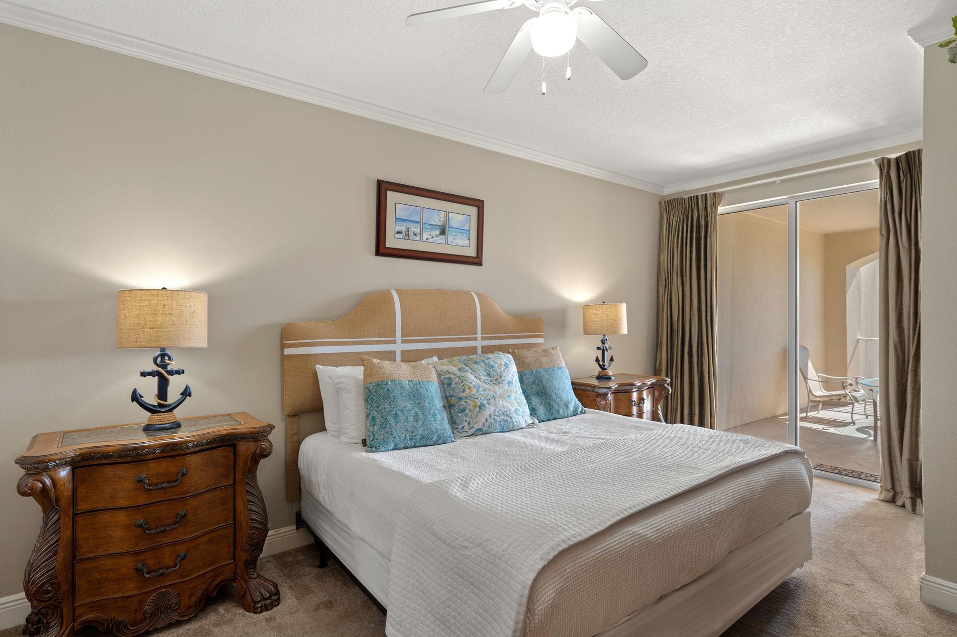 Rest peacefully in the coastalthemed bedroom with anchordetailed lamps, plush linens, and a private balcony for morning coffee.