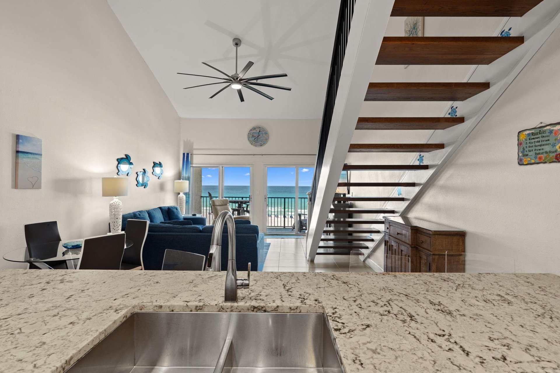 Enjoy breathtaking ocean views from your openconcept living space, complete with modern kitchen, cozy seating, and a stylish loft—perfect for your coastal getaway.
