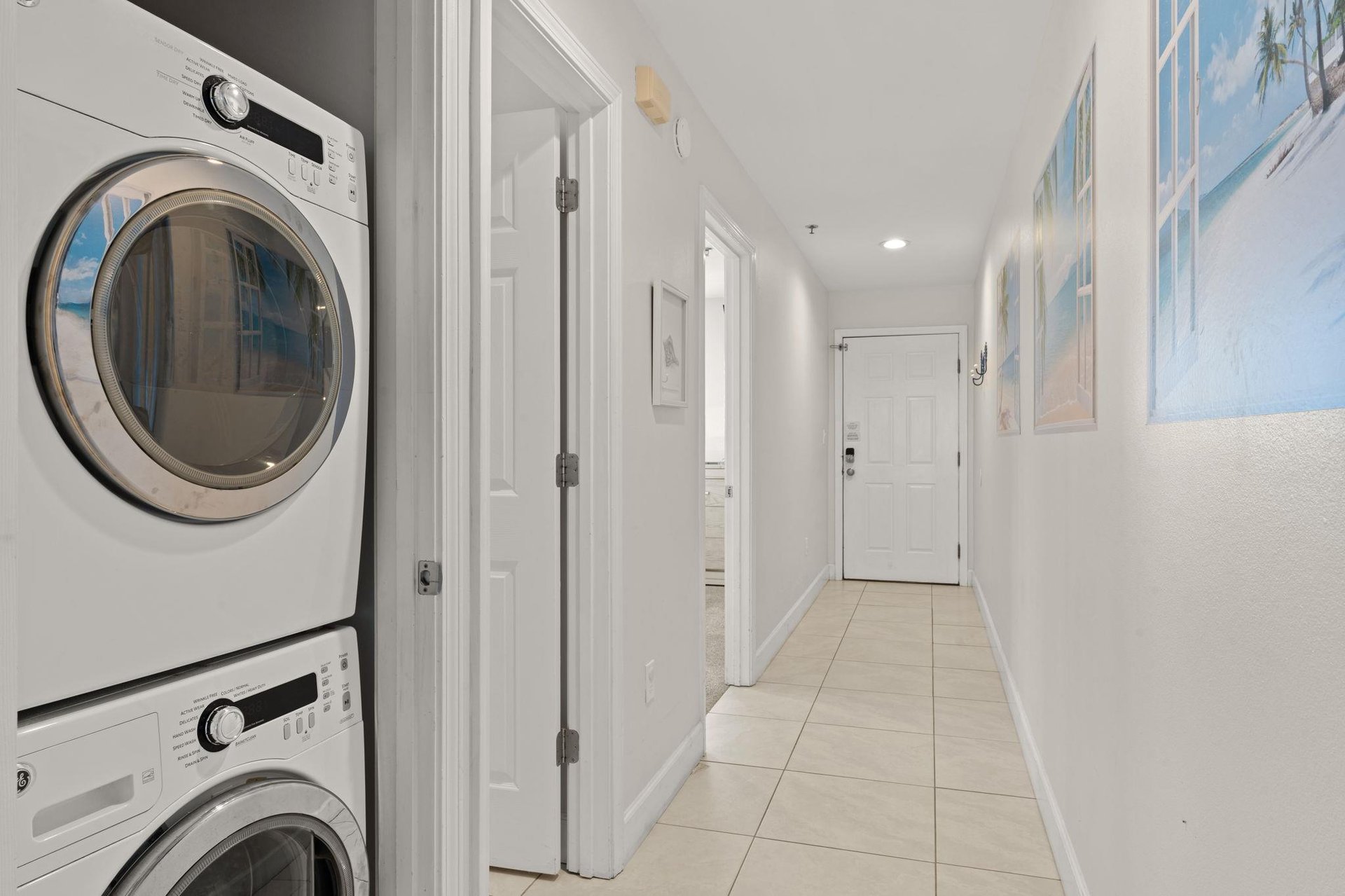 1st Floor  Your laundry is handled with stacked washer and dryer tucked neatly into the hallway, keeping your vacation effortless and your clothes fresh for beach days.
