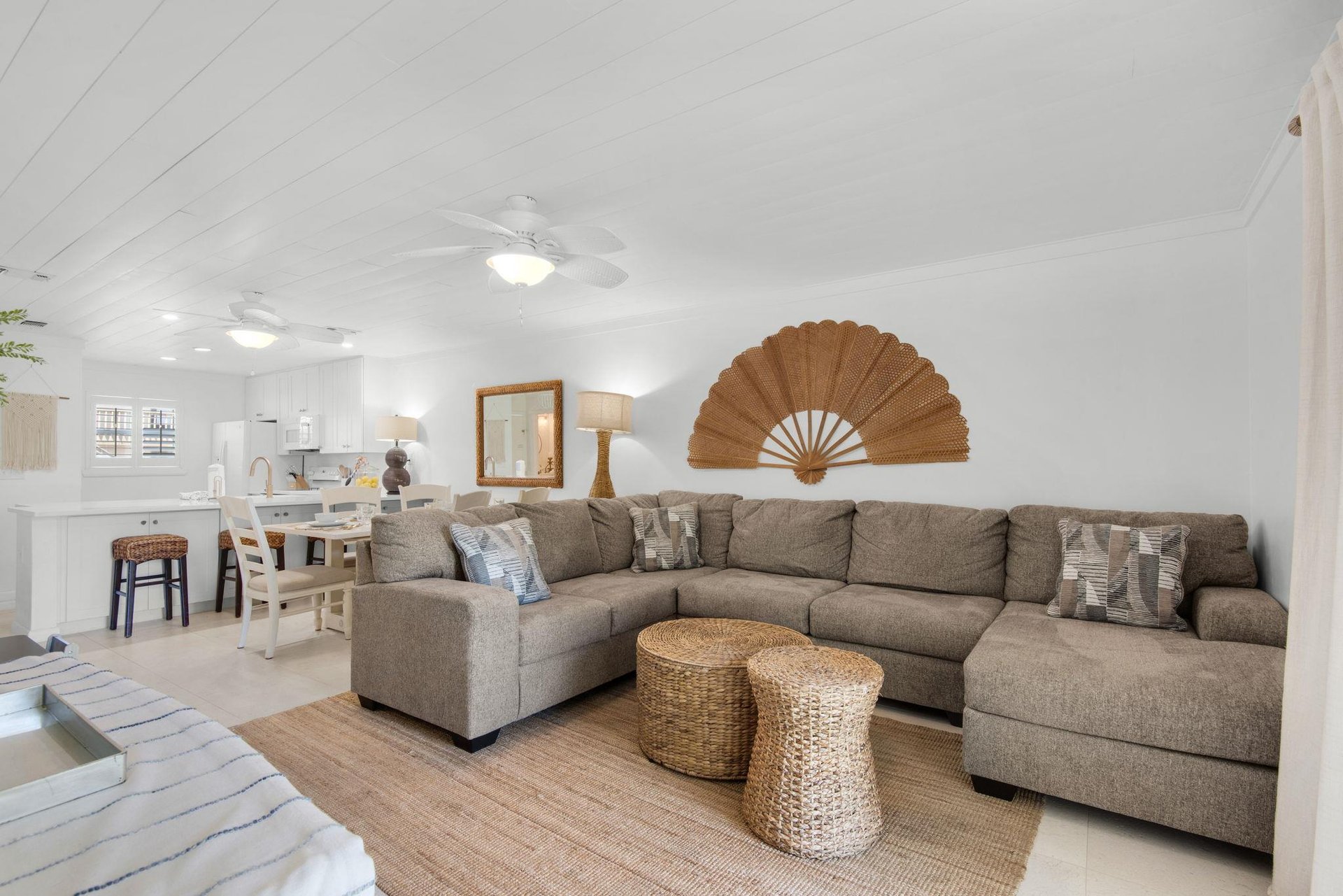 Sink into plush sofas in this airy openplan space where soft coastal tones and natural textures create your serene home base. The fullyequipped kitchen flows seamlessly into your living area for eff