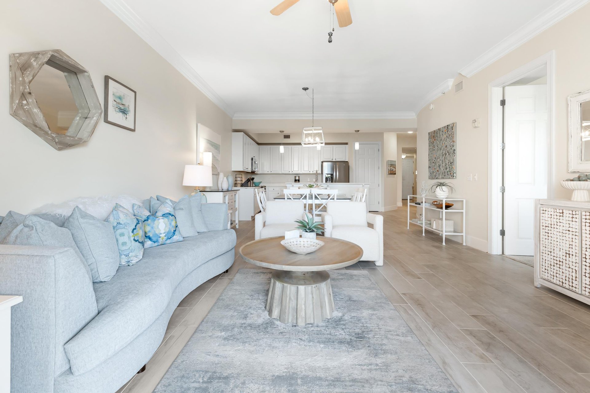 Sink into plush coastal comfort where the living room flows seamlessly into your fully equipped kitchen, creating the perfect space to unwind and gather.