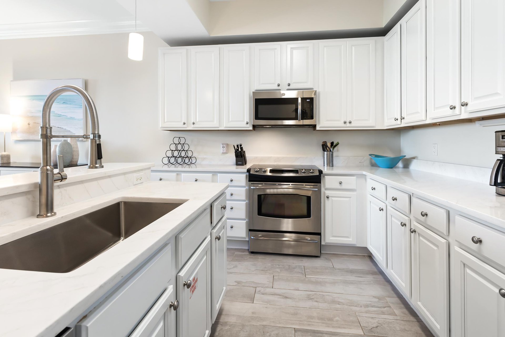 Step into your bright, fully equipped kitchen with stainless steel appliances, marble countertops, and all the tools you need to whip up delicious meals at home.
