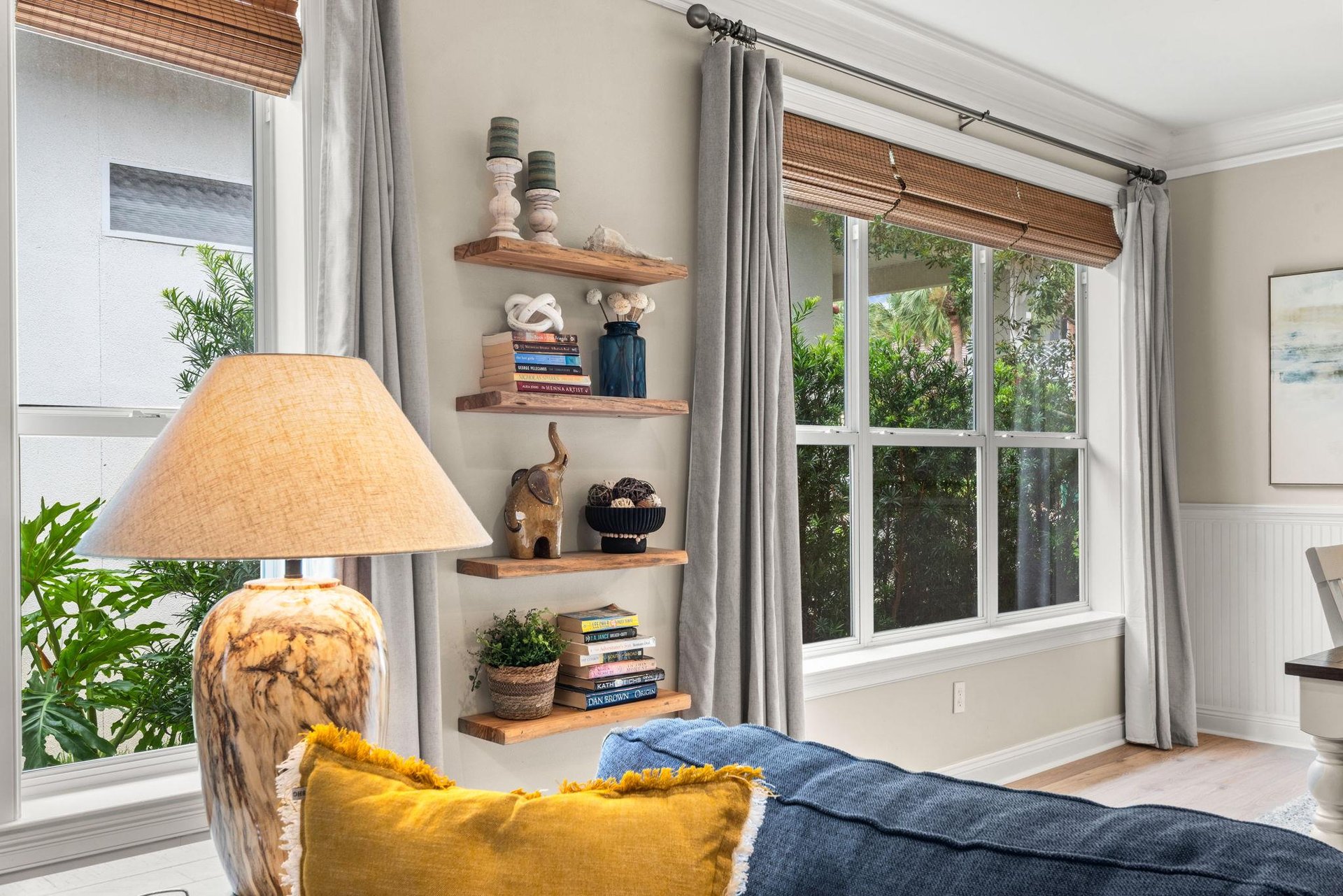 Settle into this cozy corner where natural light streams through windows inviting you to unwind with your favorite book.