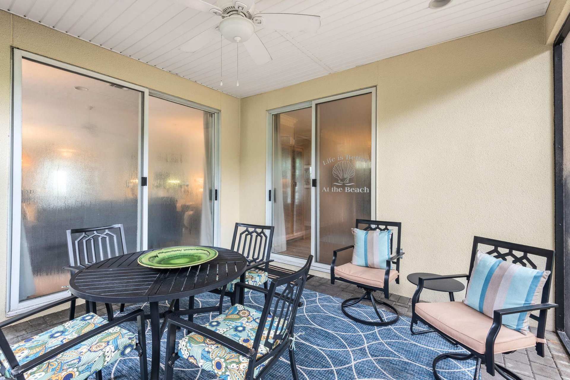 The private screened patio offers seamless indooroutdoor living just steps from the beach.