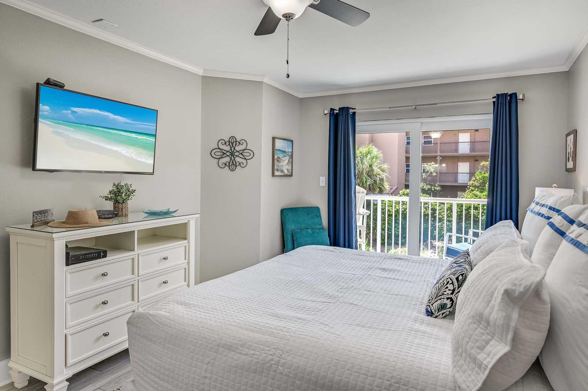 Sink into your plush bed as gentle breezes drift through the balcony doors. Coastal blues and crisp linens set a serene mood, perfect for unwinding after sunsoaked days.