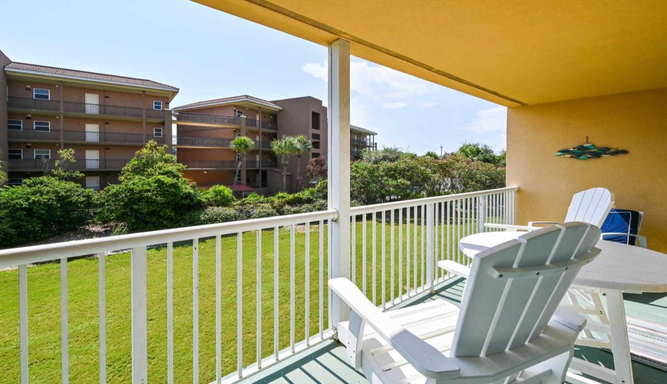 Settle into your private balcony and soak up the coastal sunshine overlooking lush green lawns, perfect for morning coffee or an evening unwind.