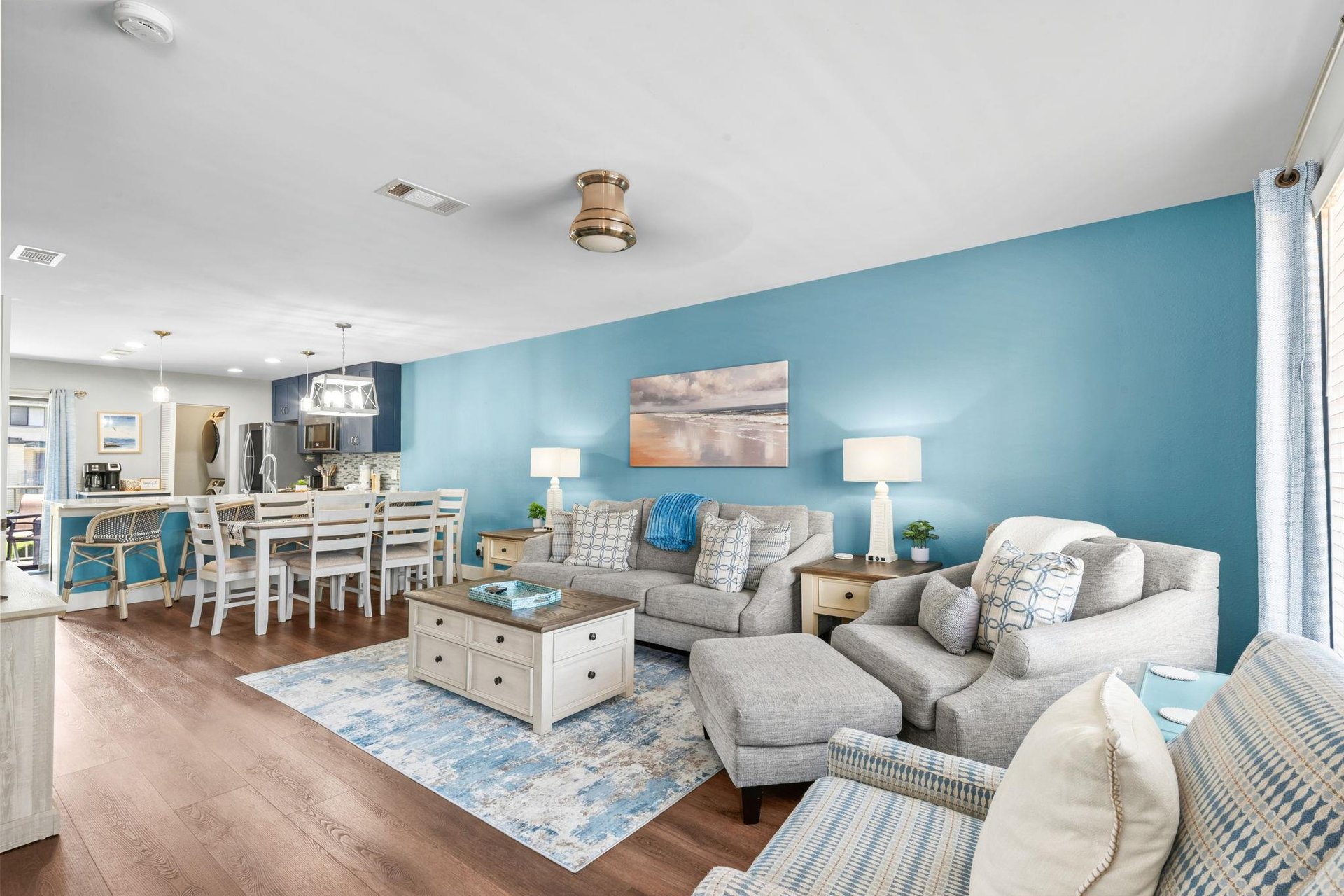 Sink into soft coastal comfort in your openconcept living and dining space and plenty of room to gather and unwind.