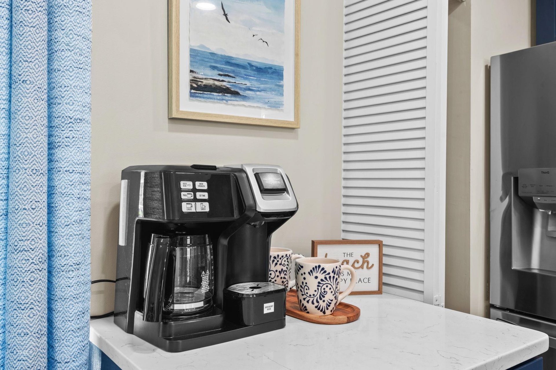 Start your mornings right with a coffee maker ready for your first cup, tucked into a bright corner that sets the tone for a relaxing getaway.
