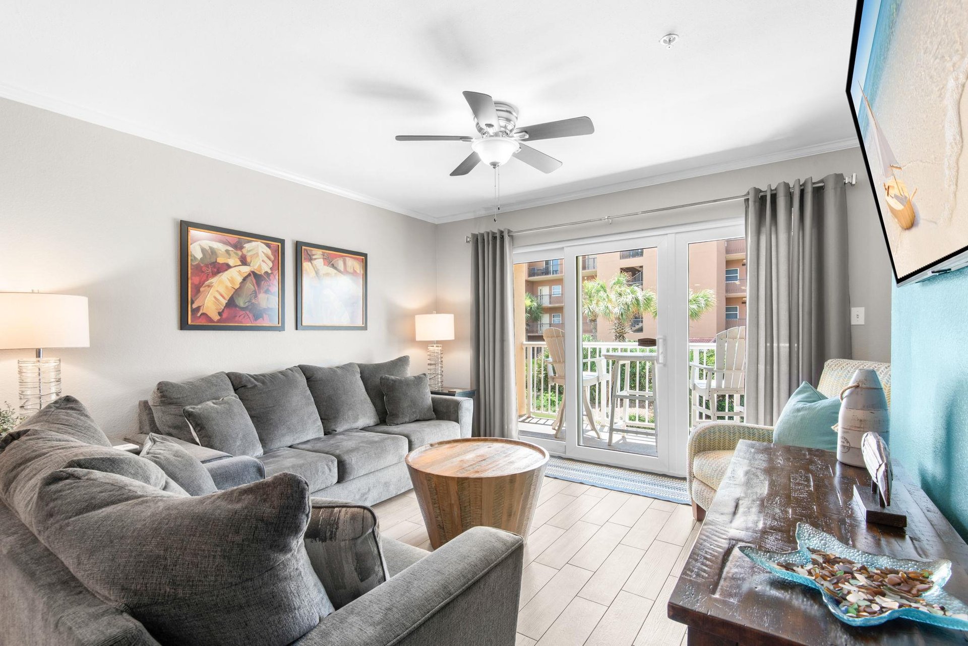 Enjoy your bright, airy living room, where a private balcony invites you to soak in the sunshine and fresh air just beyond the glass doors.
