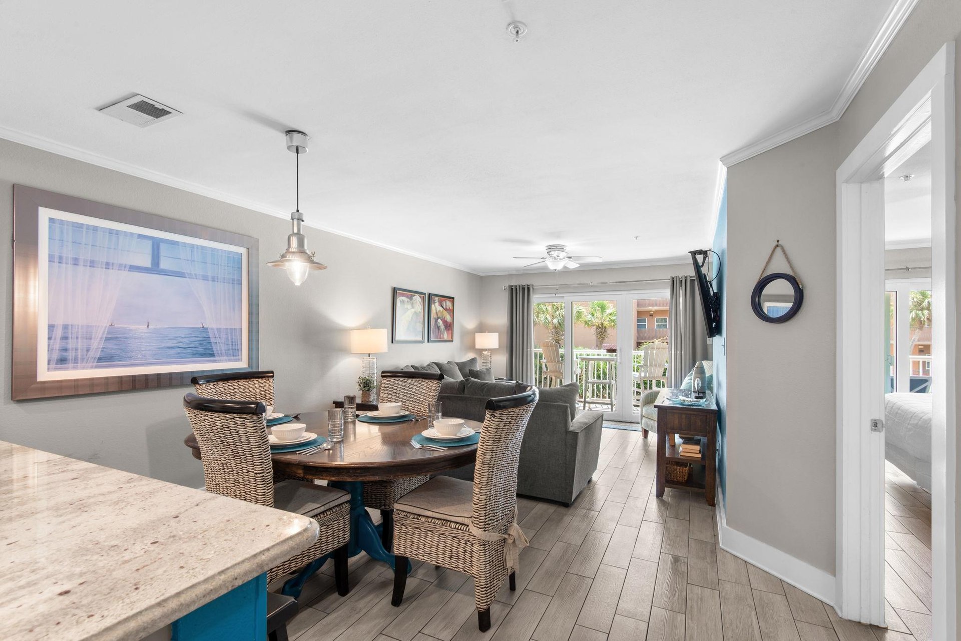 Step into your living space where natural light and beachy tones welcome you home. Gather around the dining table or relax on the sofa, with easy access to your private balcony and peaceful views beyo