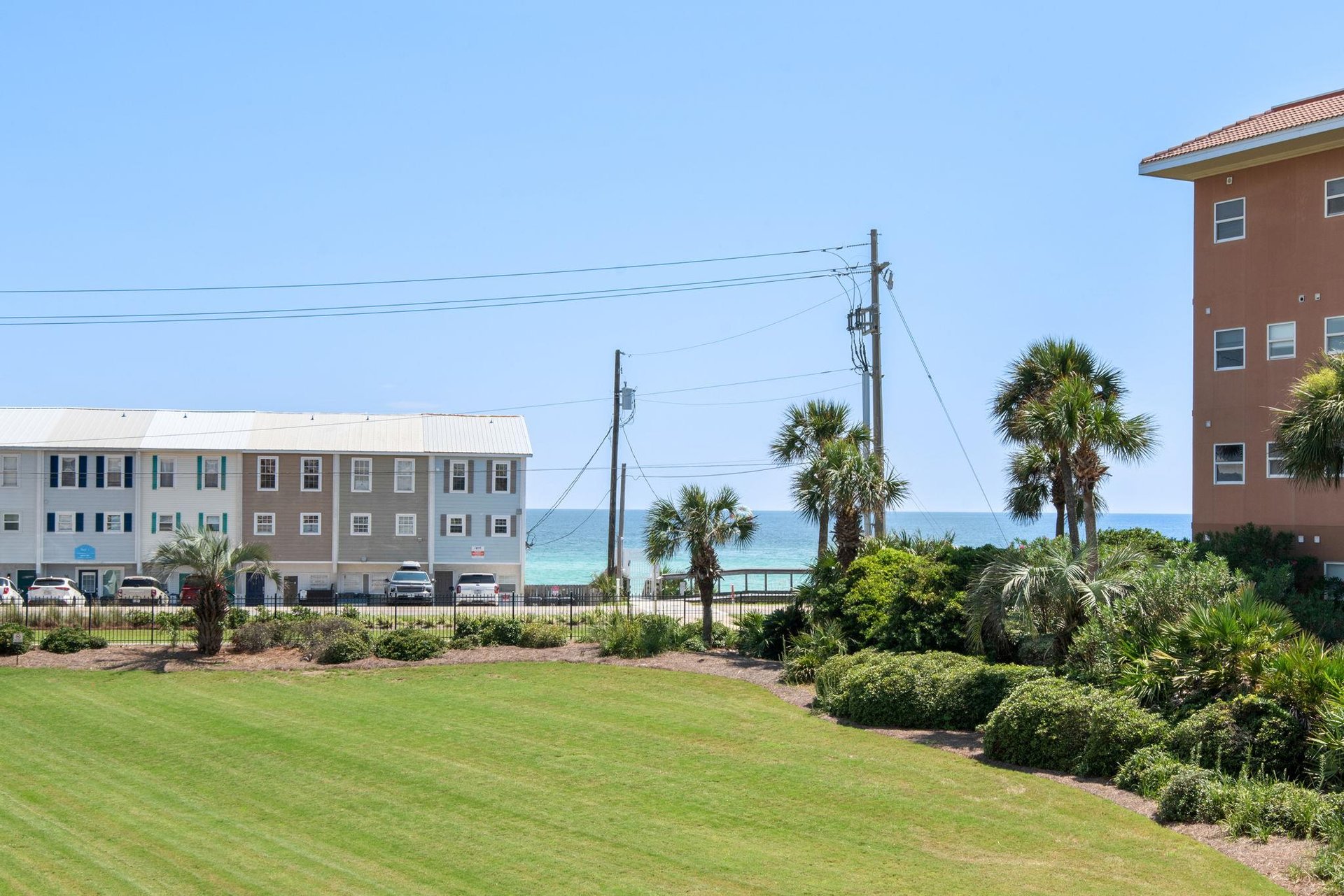 Enjoy your views of the sparkling turquoise Gulf waters between swaying palms and lush tropical landscaping—close enough to hear the waves.