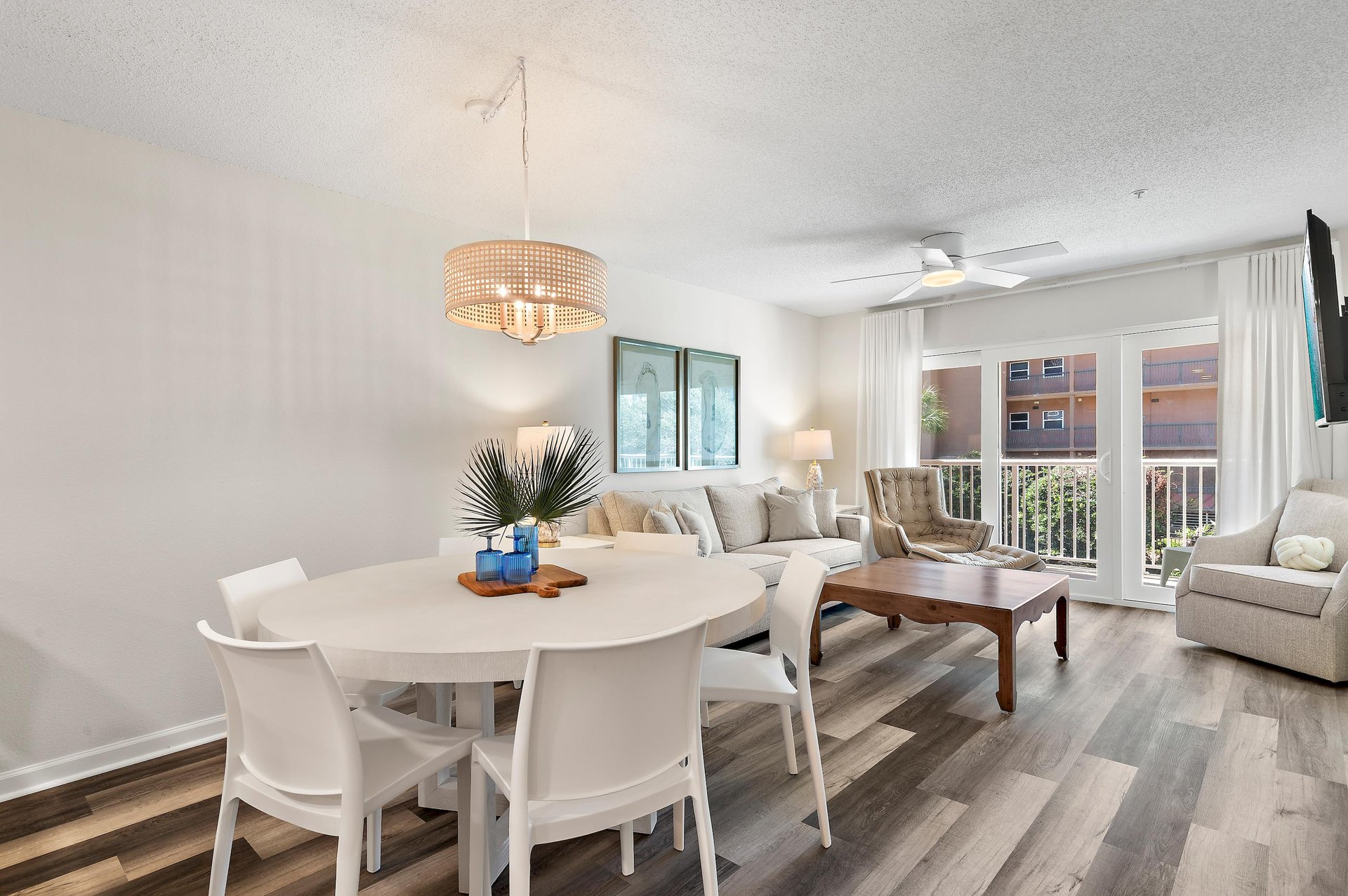 Relax in your bright living space where a plush sectional and chic dining area invite effortless gatherings.