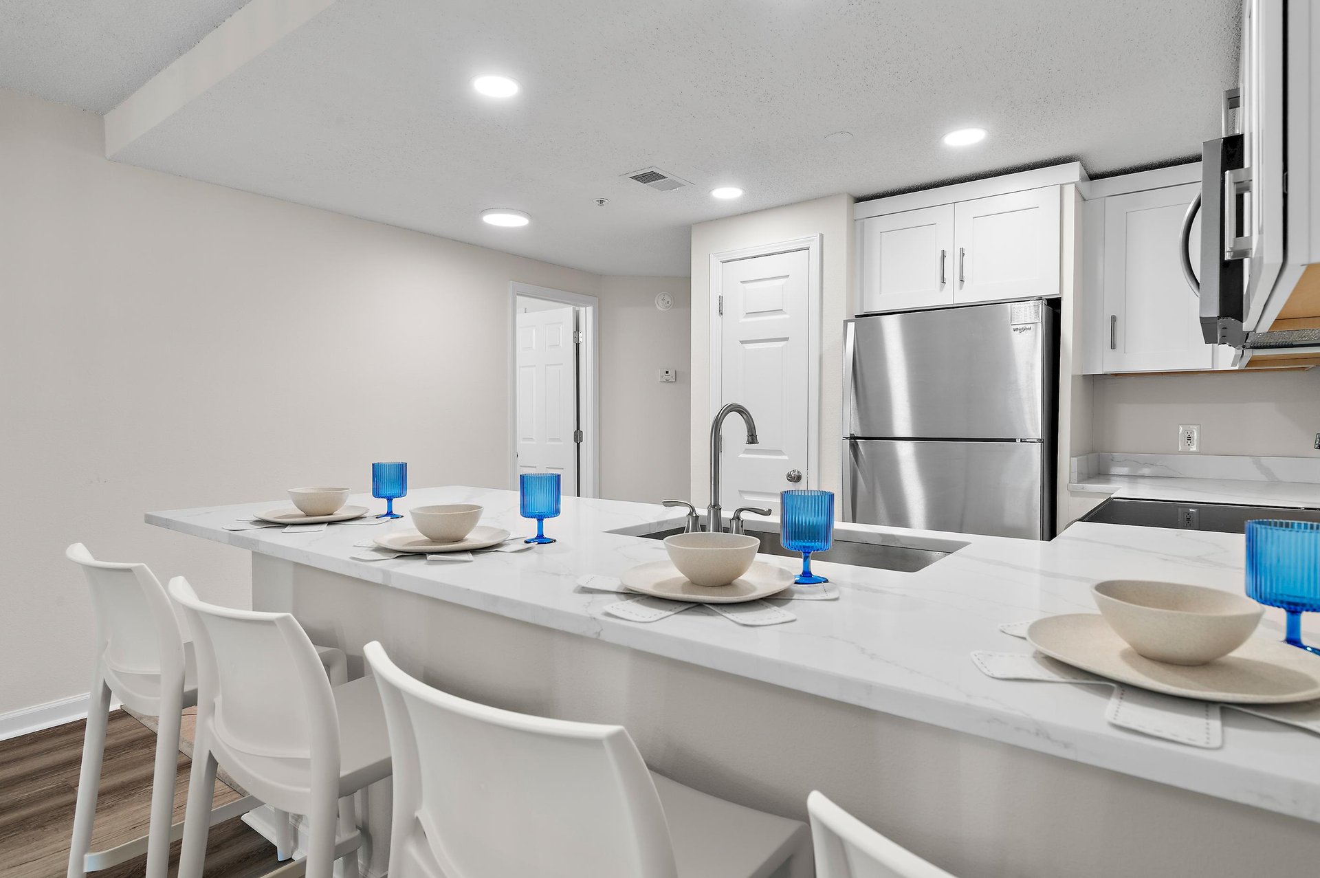 Gather around this sleek kitchen island where your group can share meals, morning coffee, or evening conversation.