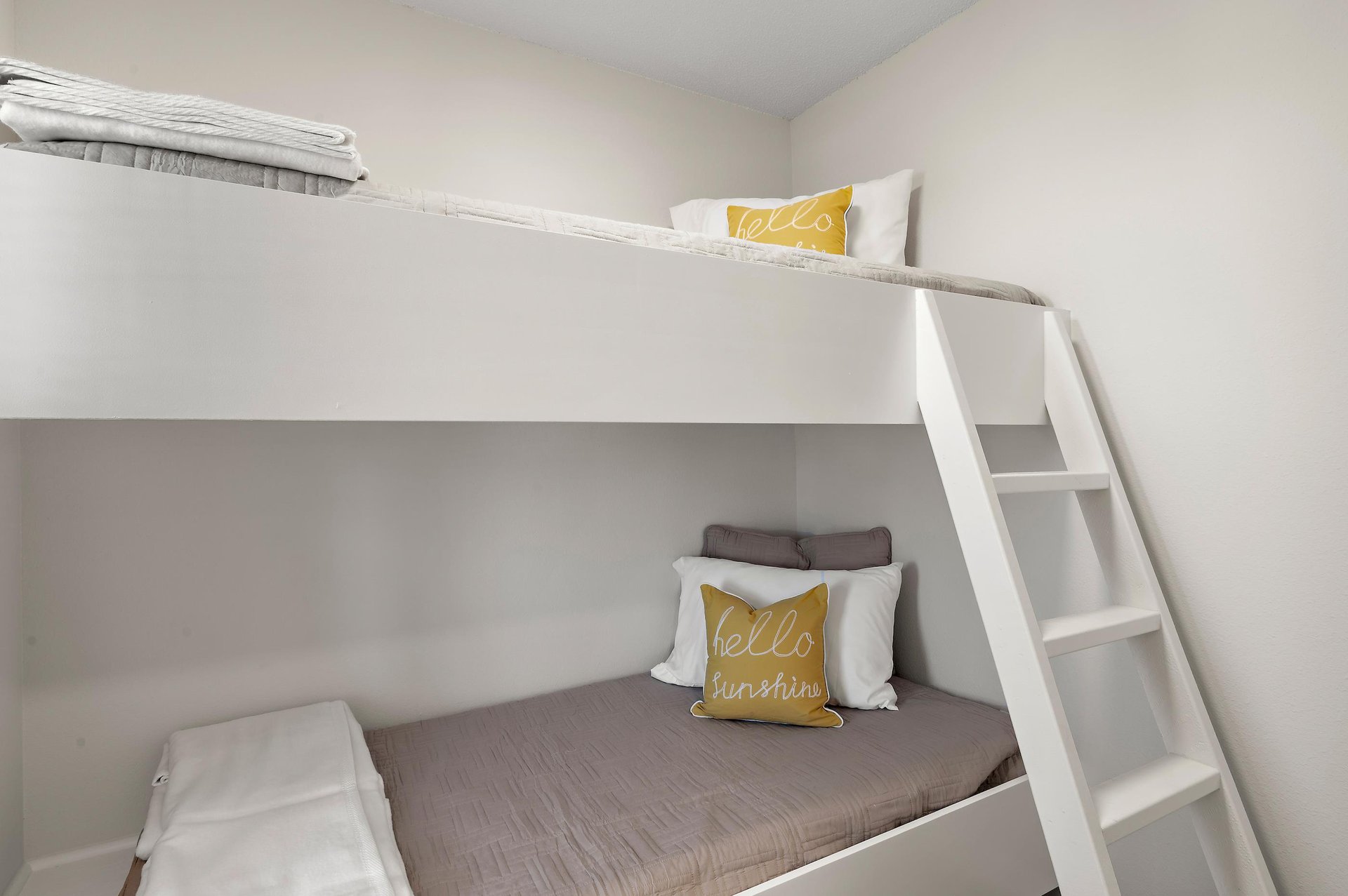 Your bunk room awaits with fresh linens and cheerful accents, perfect for kids or groups sharing the space.