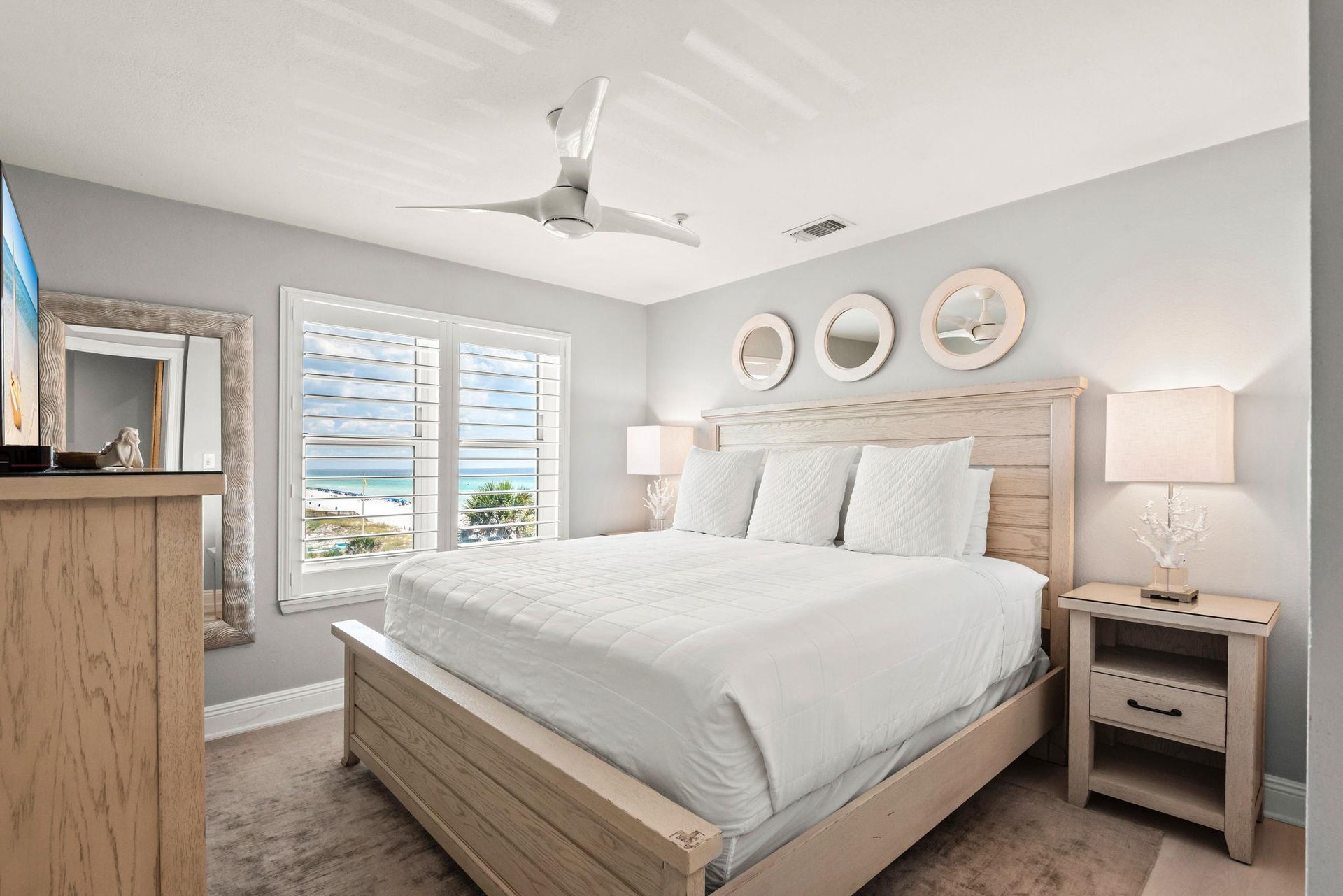 Bedroom 2, where soft blues peek through the shutters