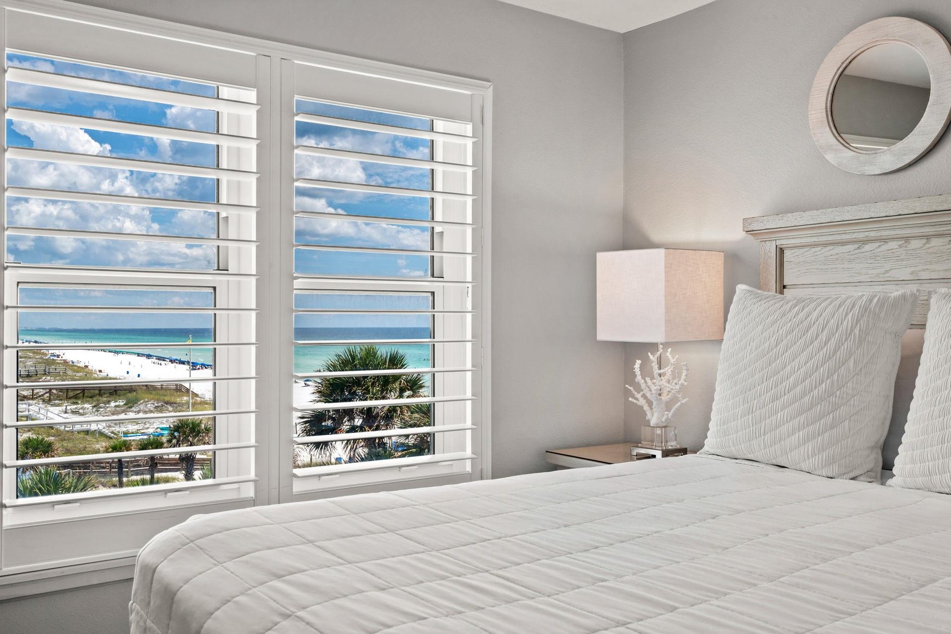Wake up to stunning ocean views framed by elegant plantation shutters.
