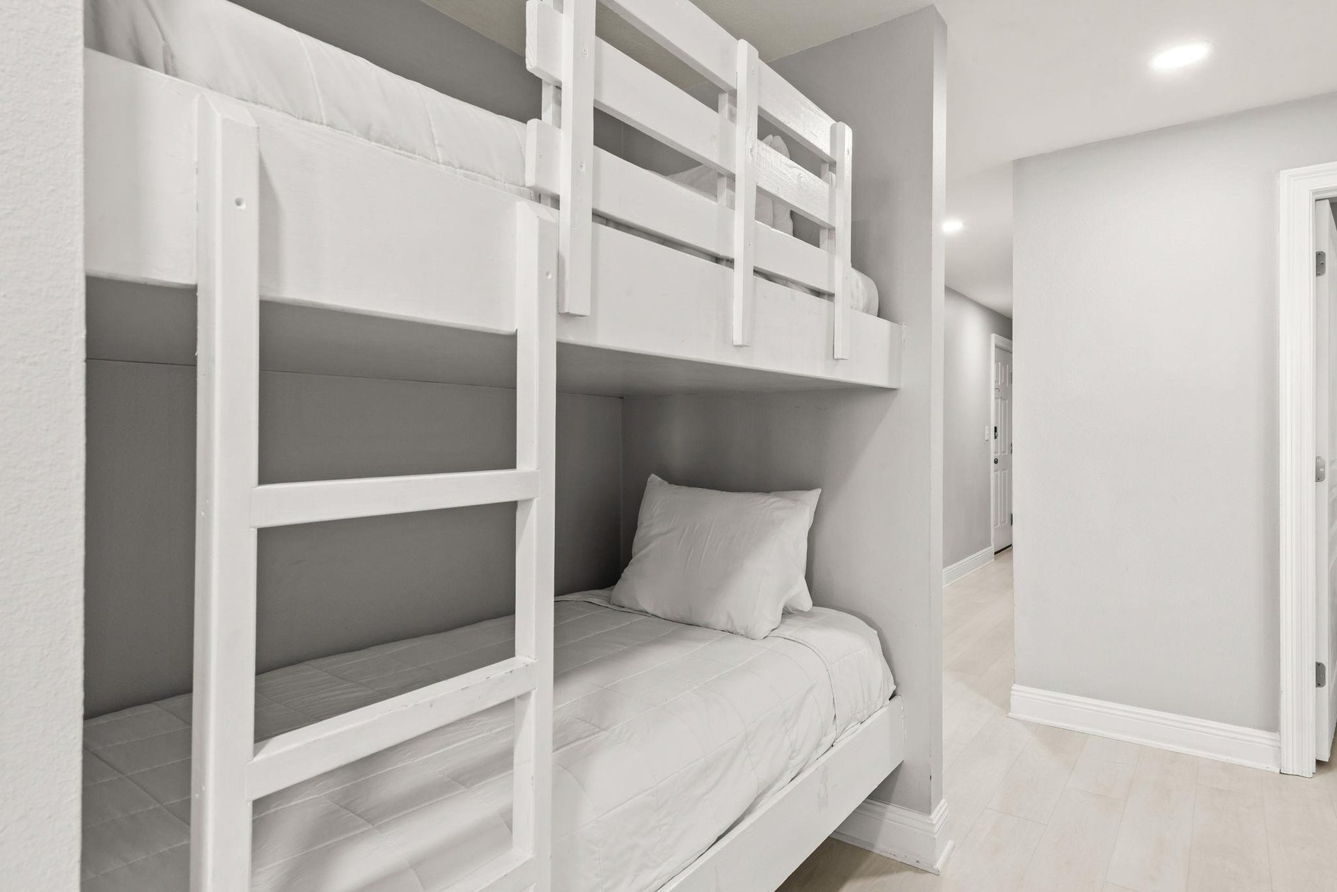 Cozy builtin bunk beds offer a stylish sleep space perfect for families or groups.