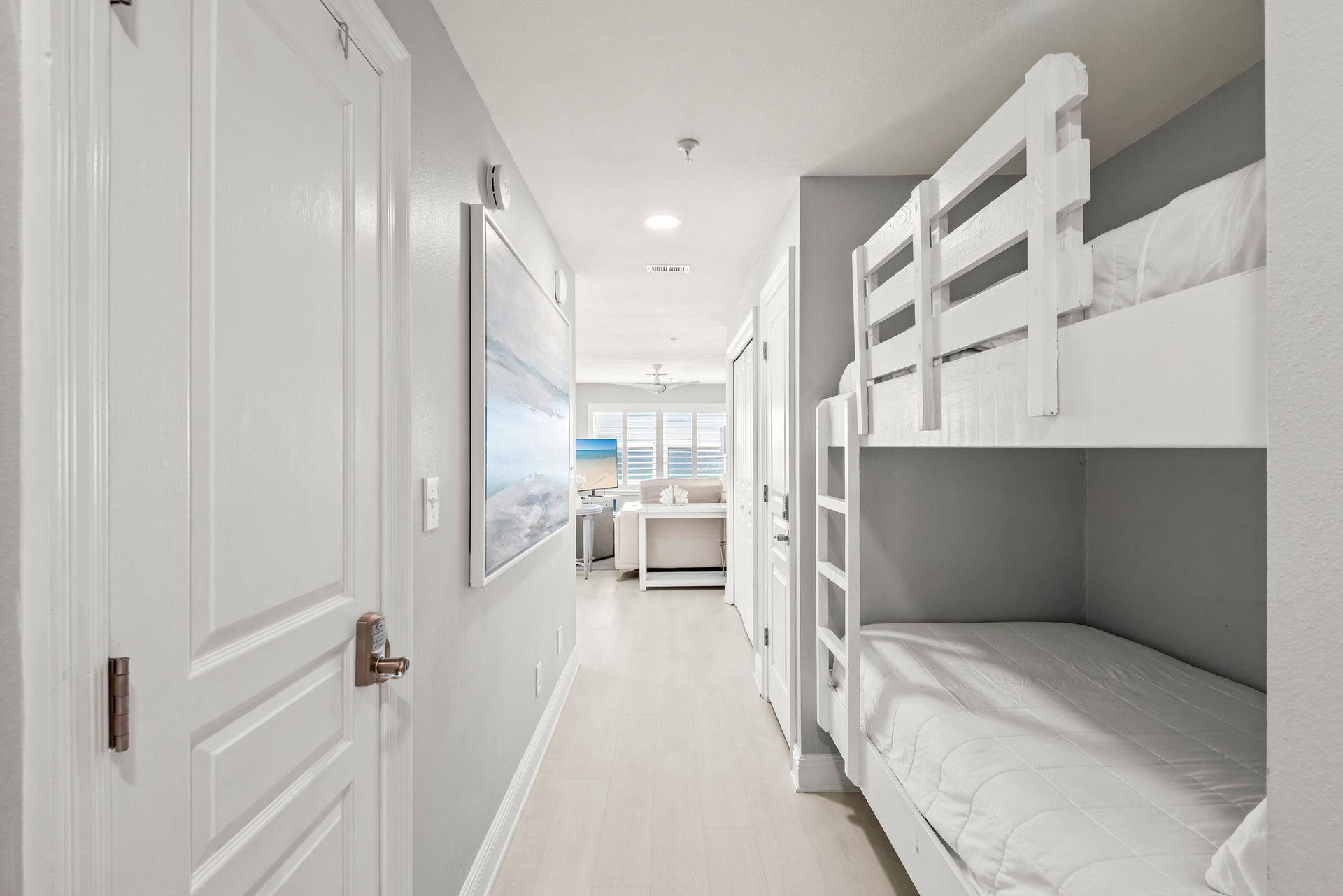 Bright hallway connects your sleeping quarters to the rest of the space, with a cozy bunk nook perfect for kids.