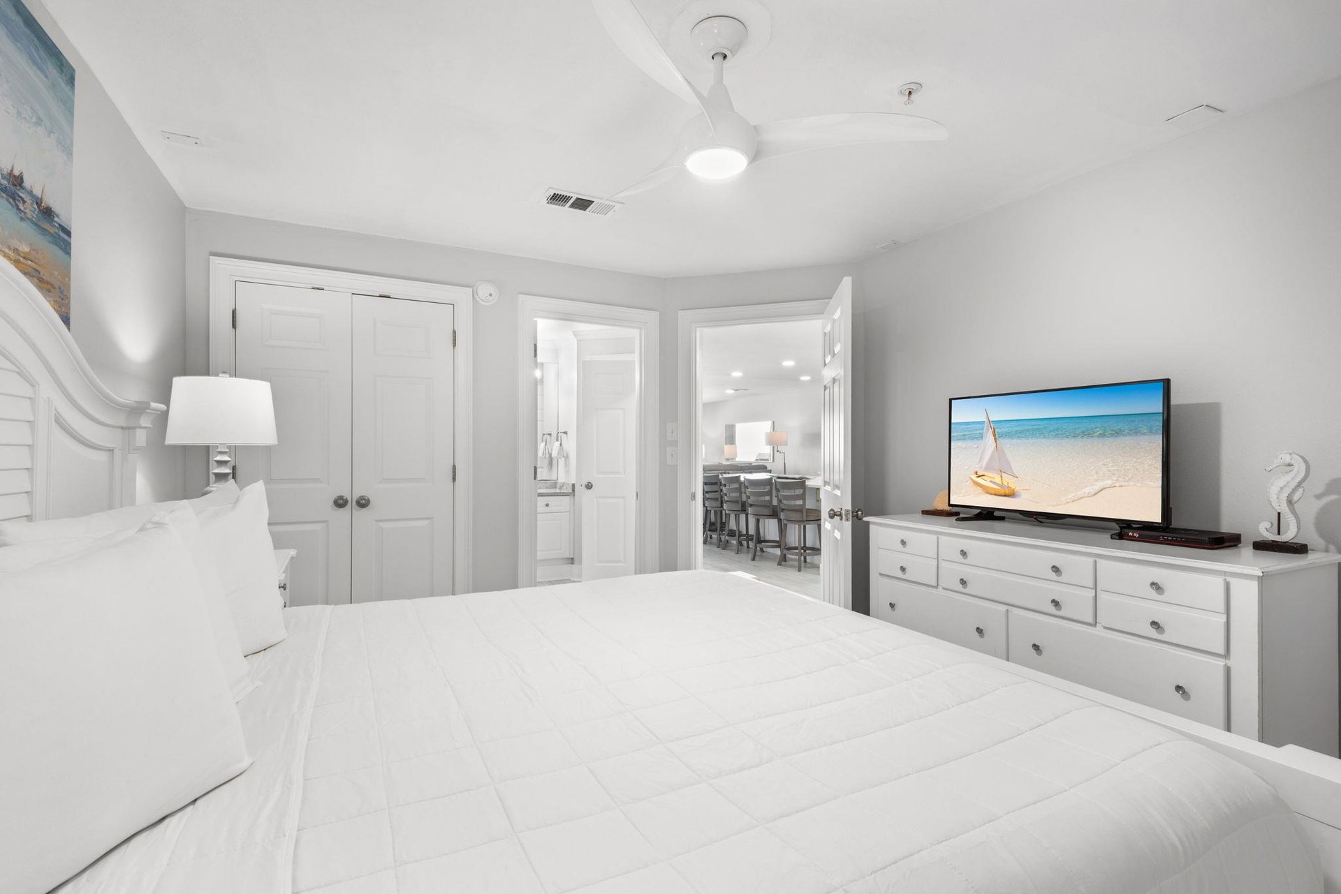 Sink into crisp white linens and let the airy, calming tones wash over you as you unwind in your private bedroom retreat. Catch a favorite show before drifting off to sleep.