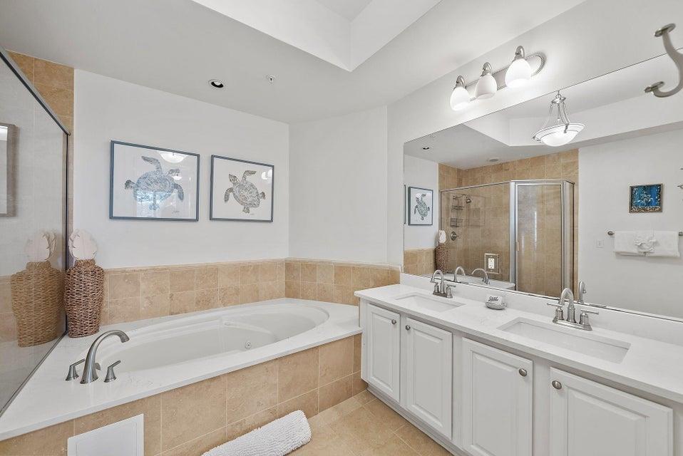 Primary Bathroom with Double Vanity, Soaking Tub, and Walk in Shower