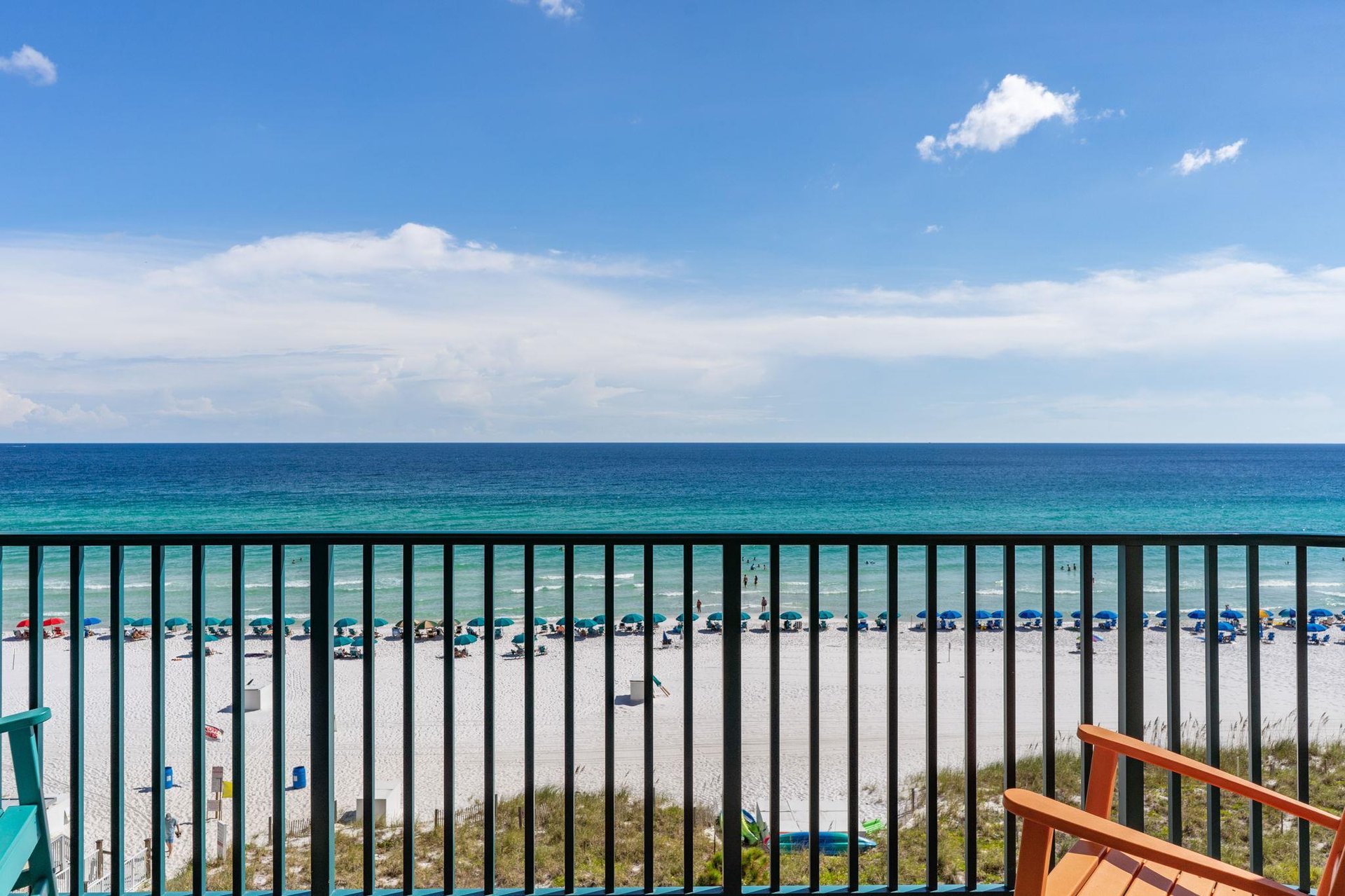 The pristine white sand beach and emerald gulf waters stretch endlessly beyond your private balcony. Watch the beachgoers relax under colorful umbrellas while you unwind in your own openair retreat.