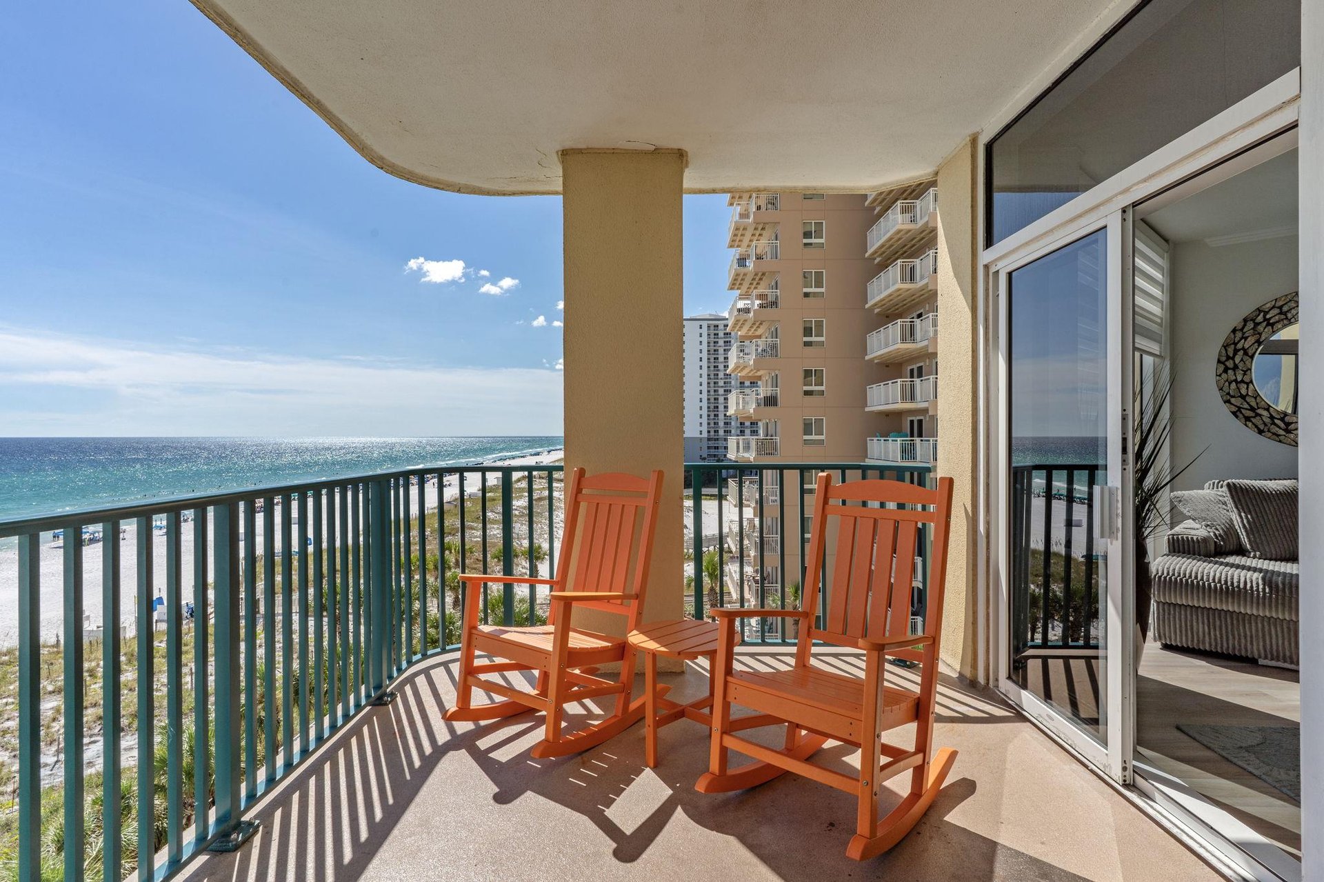 Step onto your private balcony and let the rhythm of the waves set your pace. Two rocking chairs invite you to sit back and savor stunning ocean views just beyond the railing.