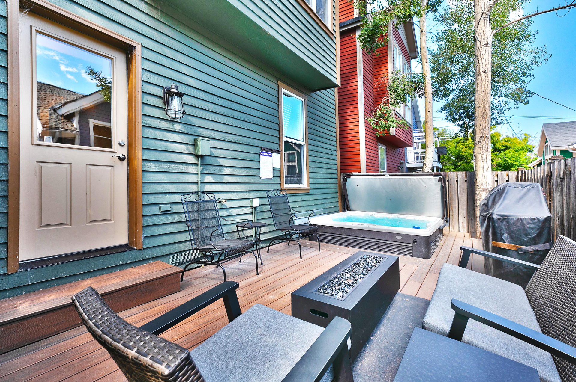 Private patio with patio furniture, gas outdoor fire pit and hot tub