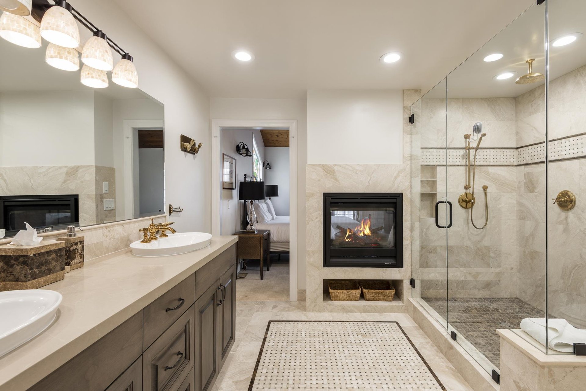 Ensuite main bathroom with dual facing fireplace