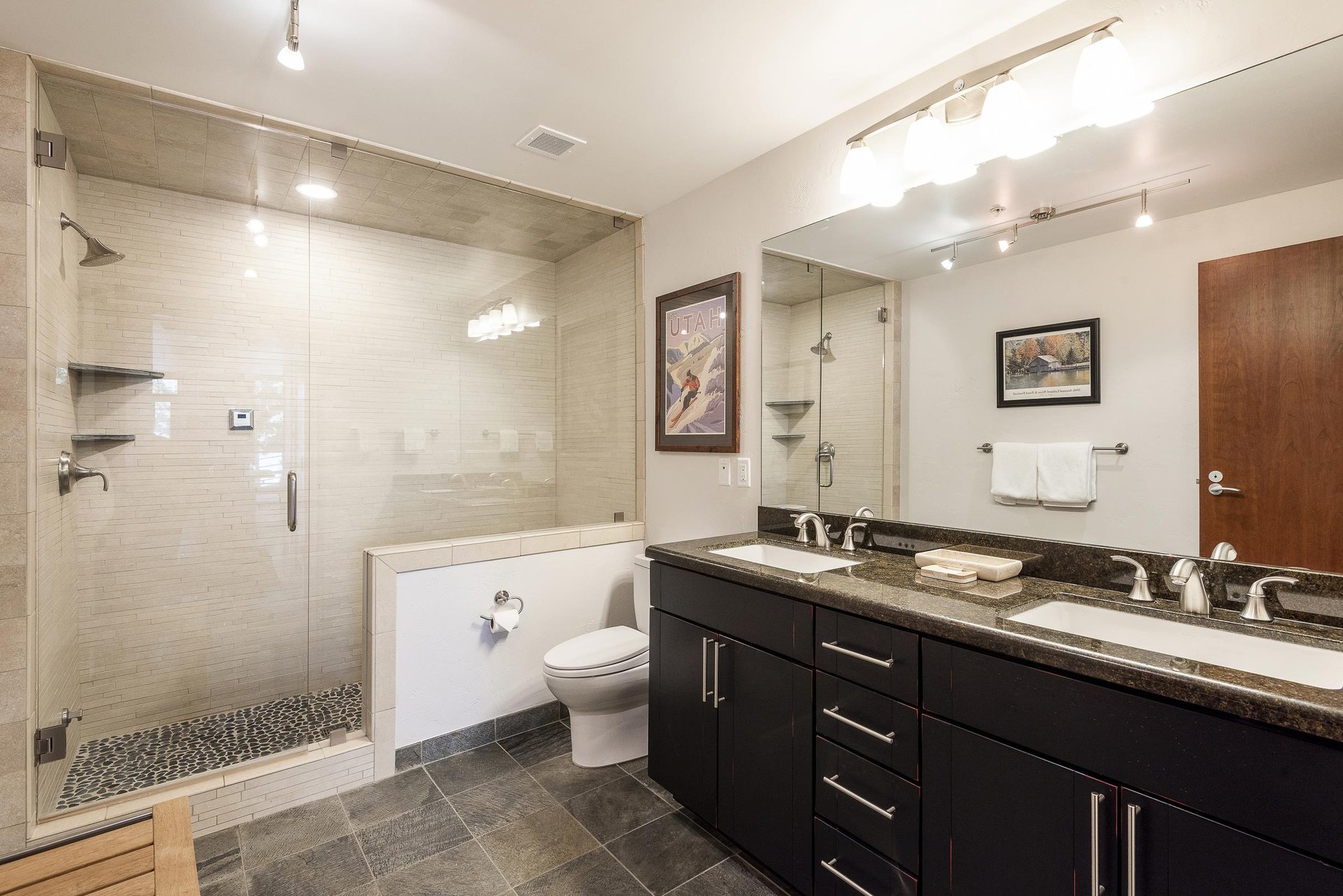 34 hallway bathroom with walk in glass paneled shower, slate tiles, double vanity