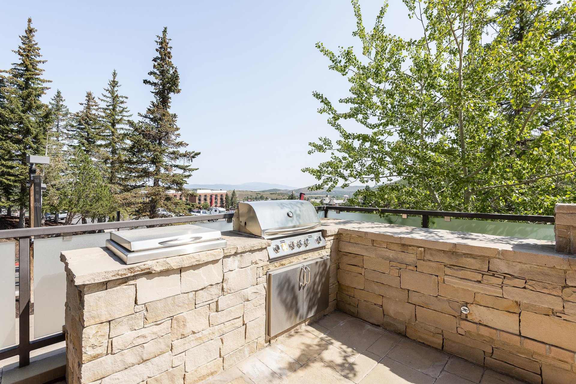 BBQ grill in flagstone setup on the private patio
