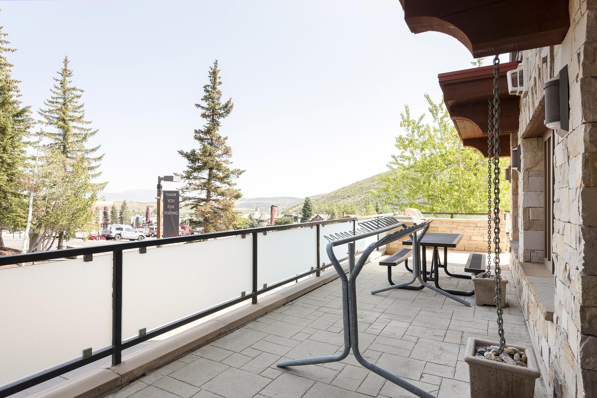 Private ski rack on patio with picnic table in the background