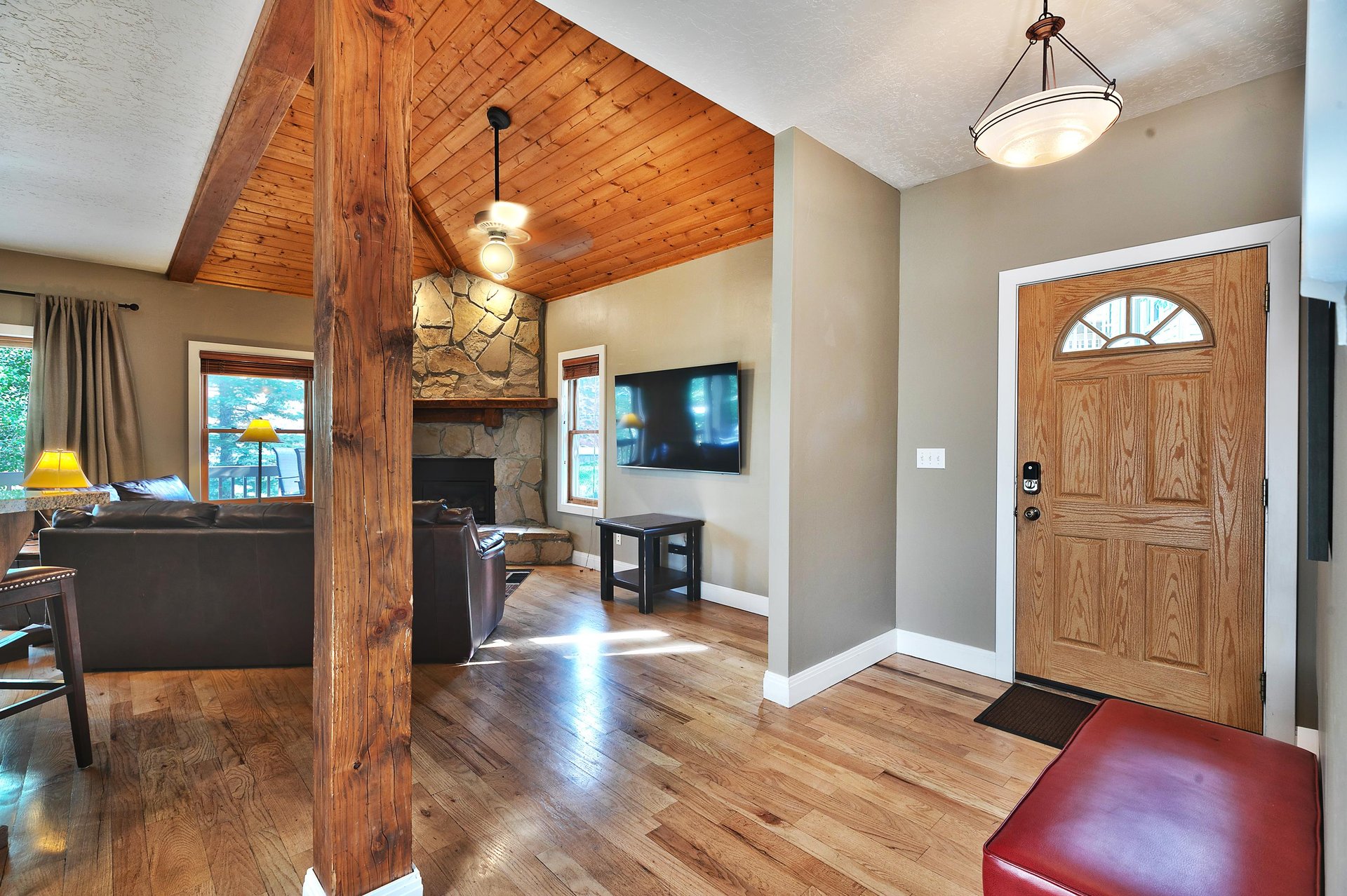 Canyon Crossing 23 entrance, impressive wooden support beam, hardwood floors and wooden accents