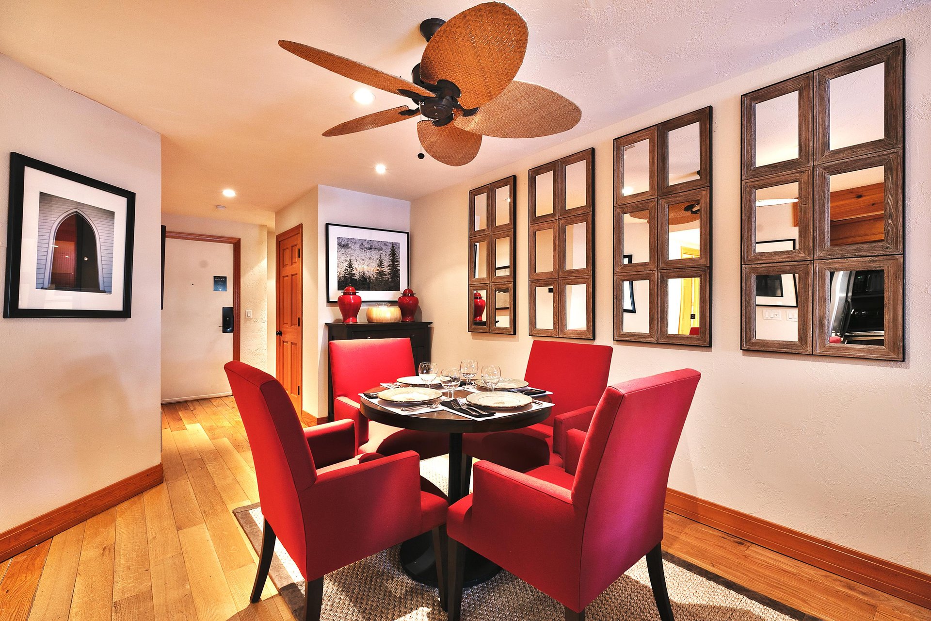 Dining area features a round table with seating for 4