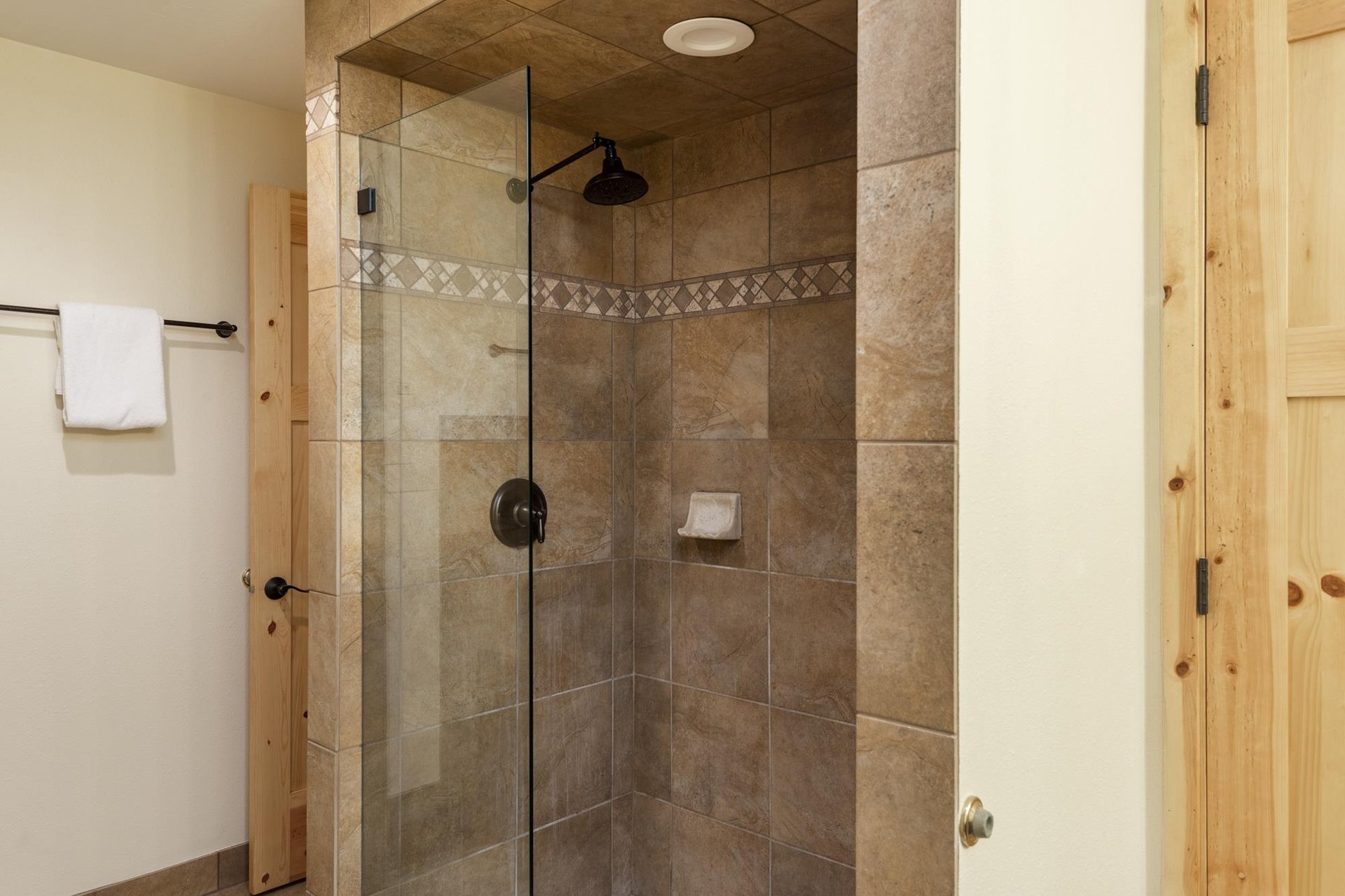 Beautiful walkin tiled shower in the main bedroom
