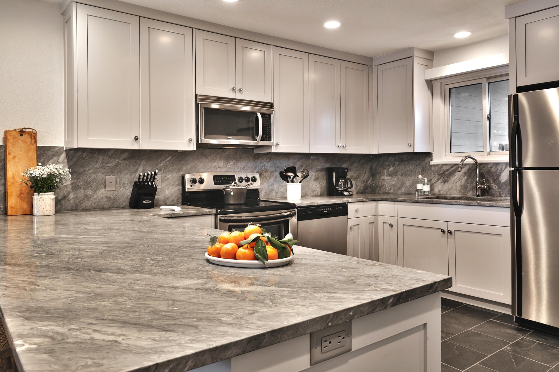 Beautifully upgraded kitchen features stainless steel appliances