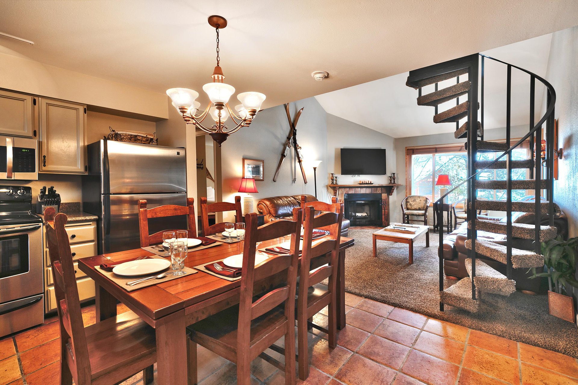 Dining are has a rectangle dining table and seating for six with high back chairs