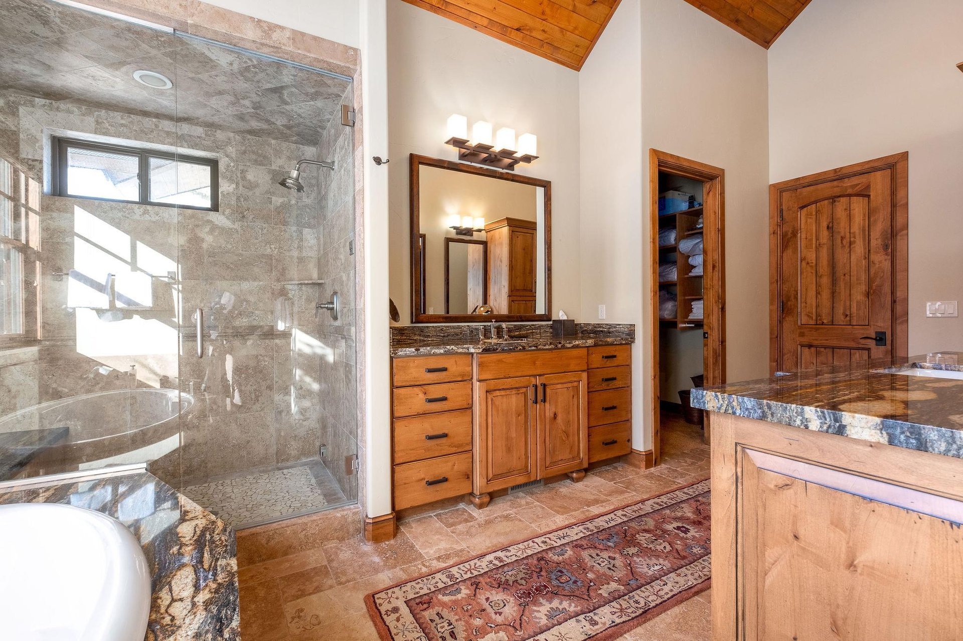 Luxurious bathroom with walk in closet