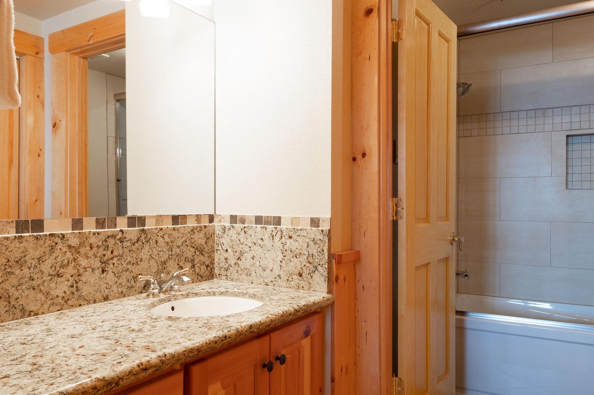 Full bathroom with bedroom and hallway access
