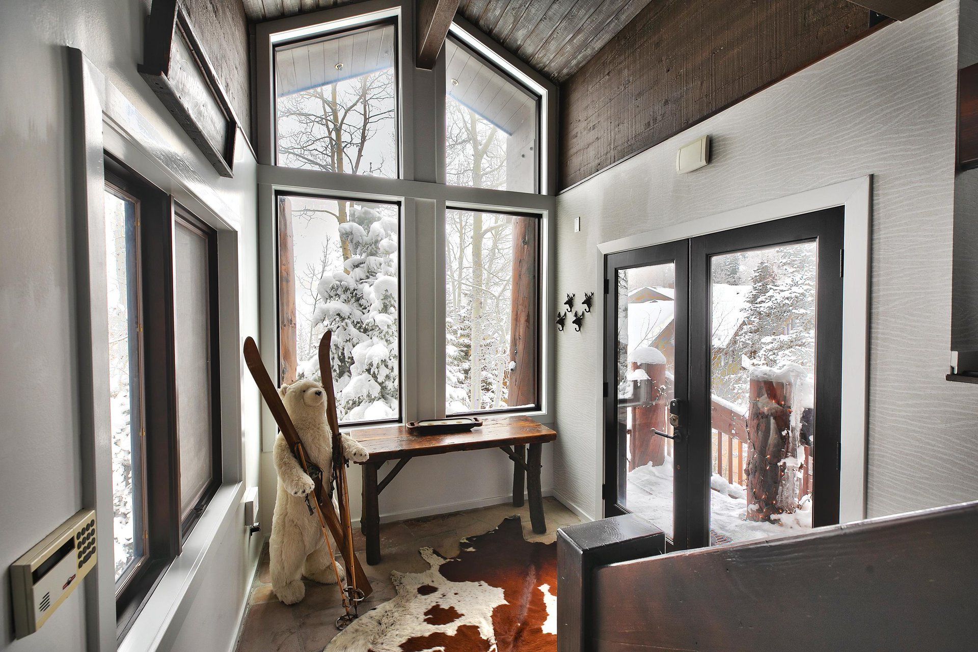 Entryway with bright natural light and welcome ski polar bear