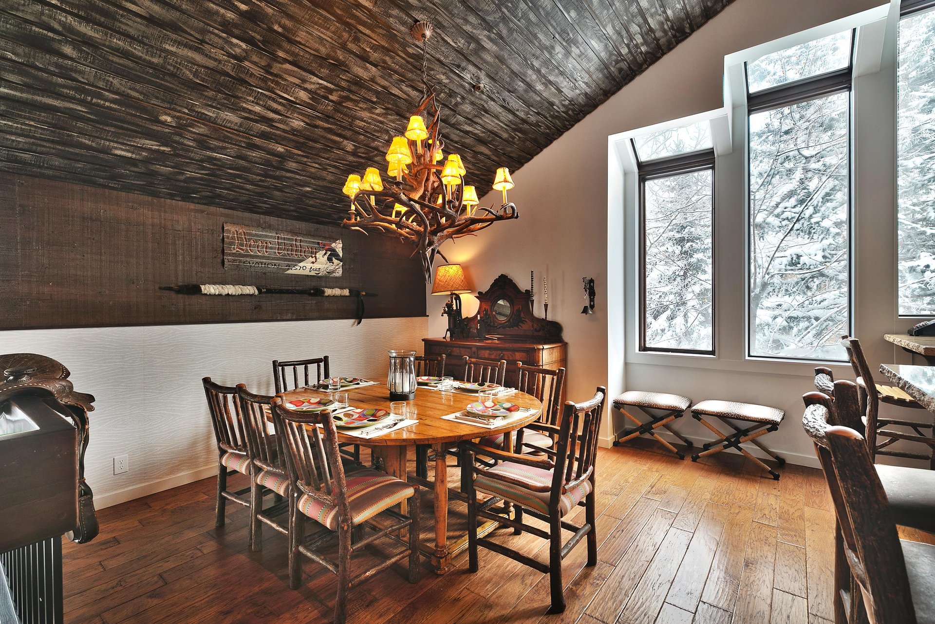 Intimate dining area with solid wooden dining table and log wood dining chairs